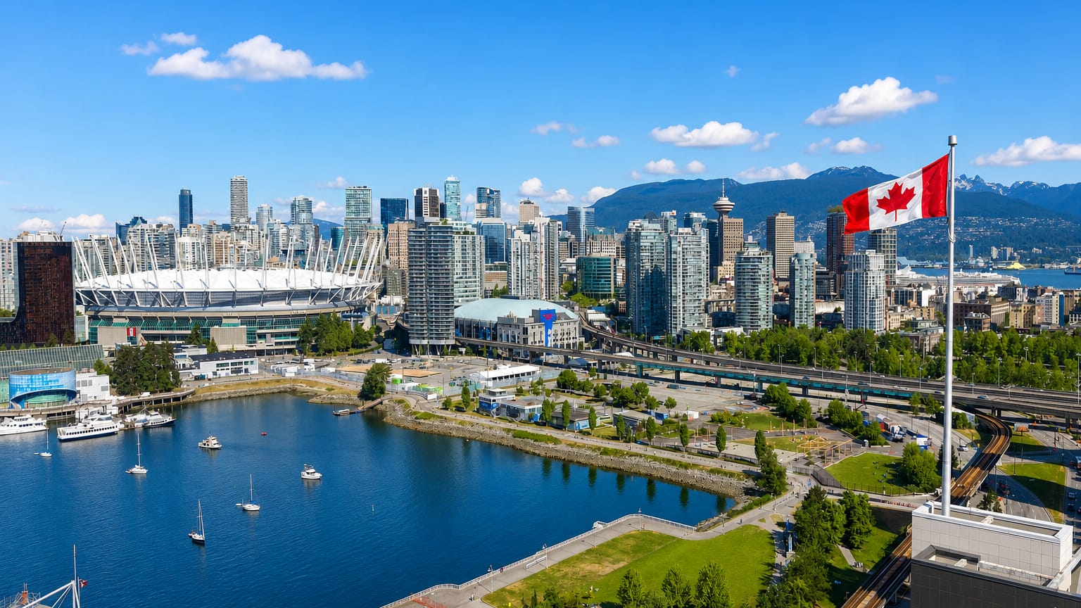 Vancouver skyline with BC Place stadium and False Creek boats below the North Shore mountains and a Canadian flag.