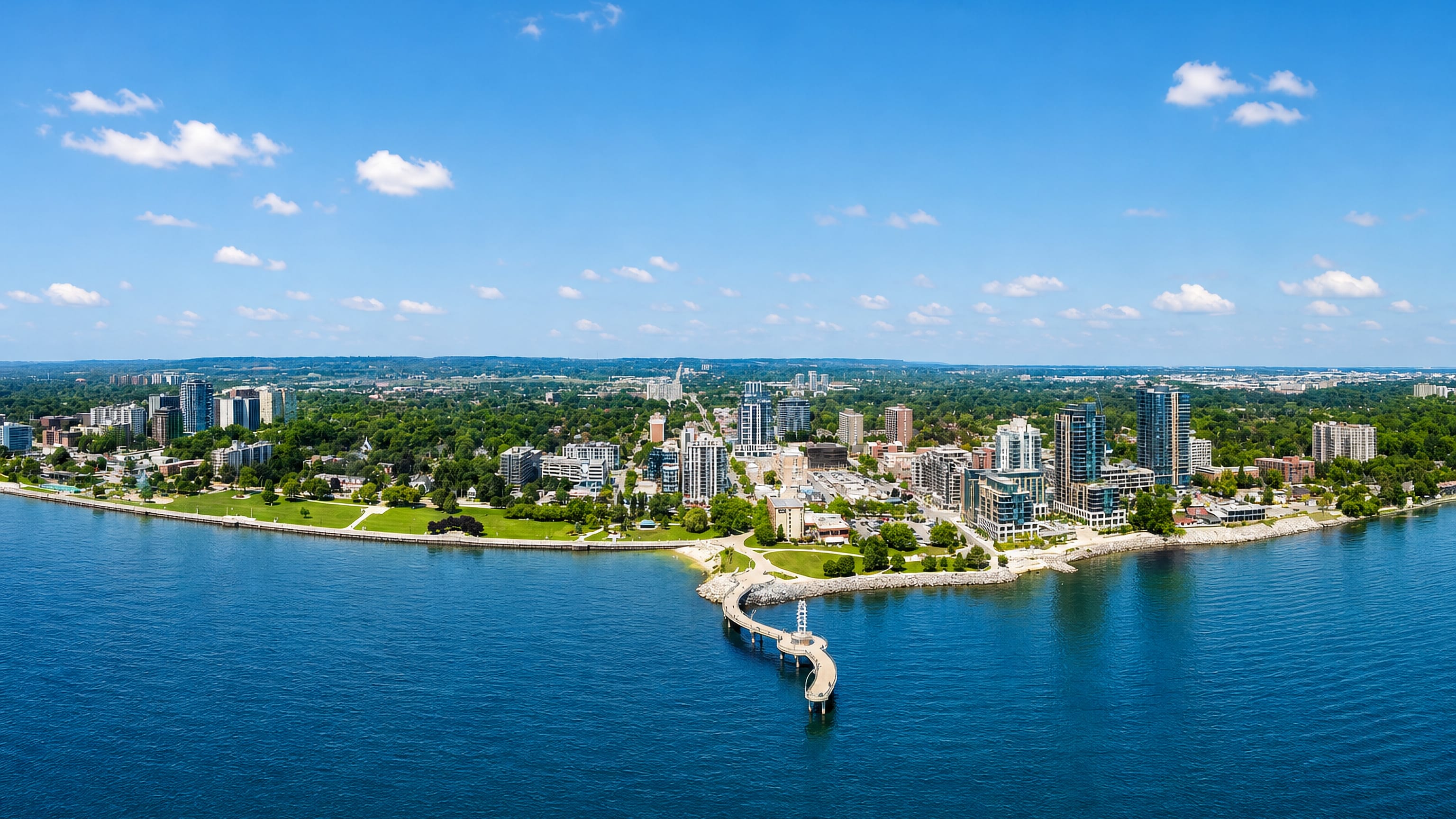 Burlington, Ontario, from Lake Ontario, showing the curved Brant Street Pier, Spencer Smith Park and downtown towers.