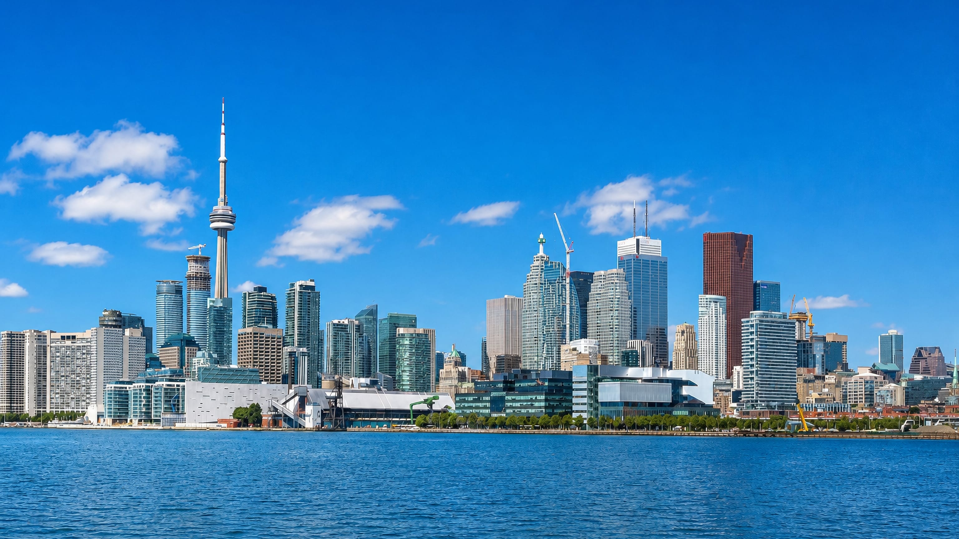 Old Toronto's downtown skyline and the CN Tower rising above the Lake Ontario waterfront.