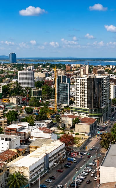 Brazzaville's downtown skyline with the cylindrical Nabemba Tower rising above office blocks by the Congo River.