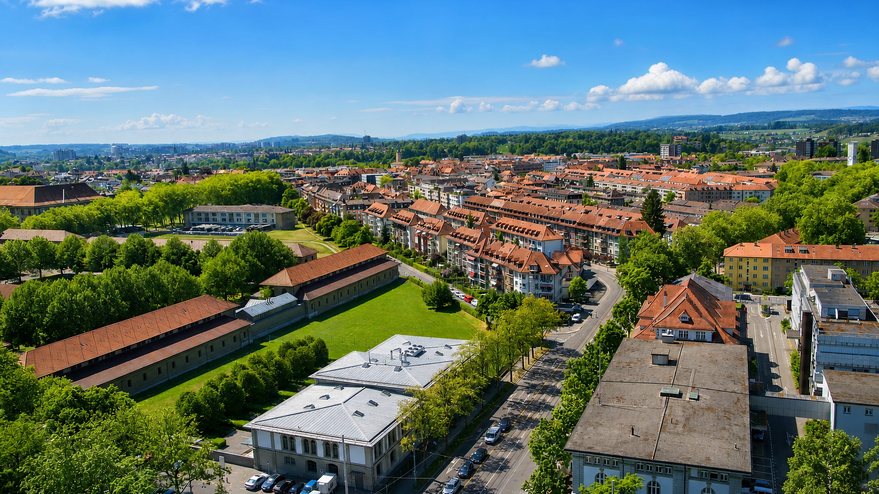 Aerial view over the tiled rooftops and barracks courtyard of the Breitenrain quarter in Bern, Switzerland