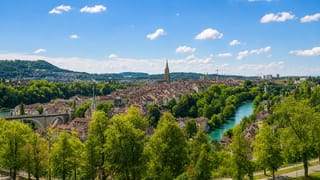 Bern's old town in the turquoise Aare river loop, with the Minster spire and the Federal Palace dome
