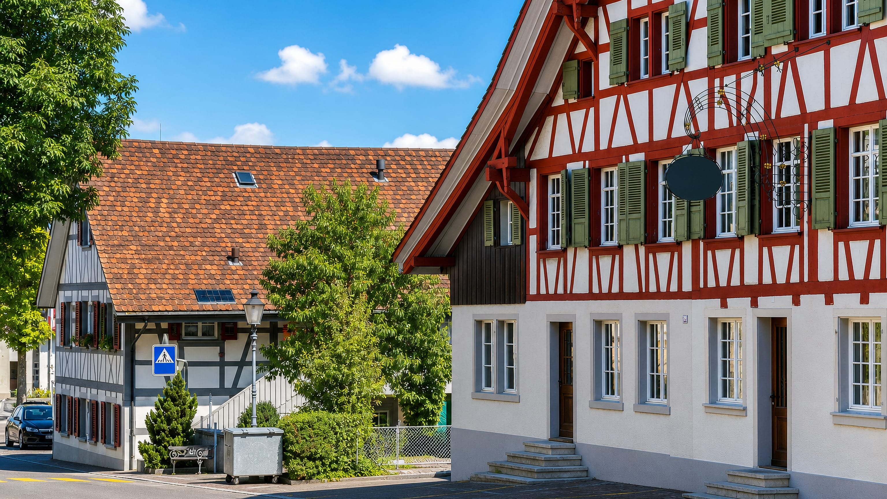 Red-and-white half-timbered houses along a quiet lane in Oberwinterthur (Kreis 2) / Talacker, Winterthur.