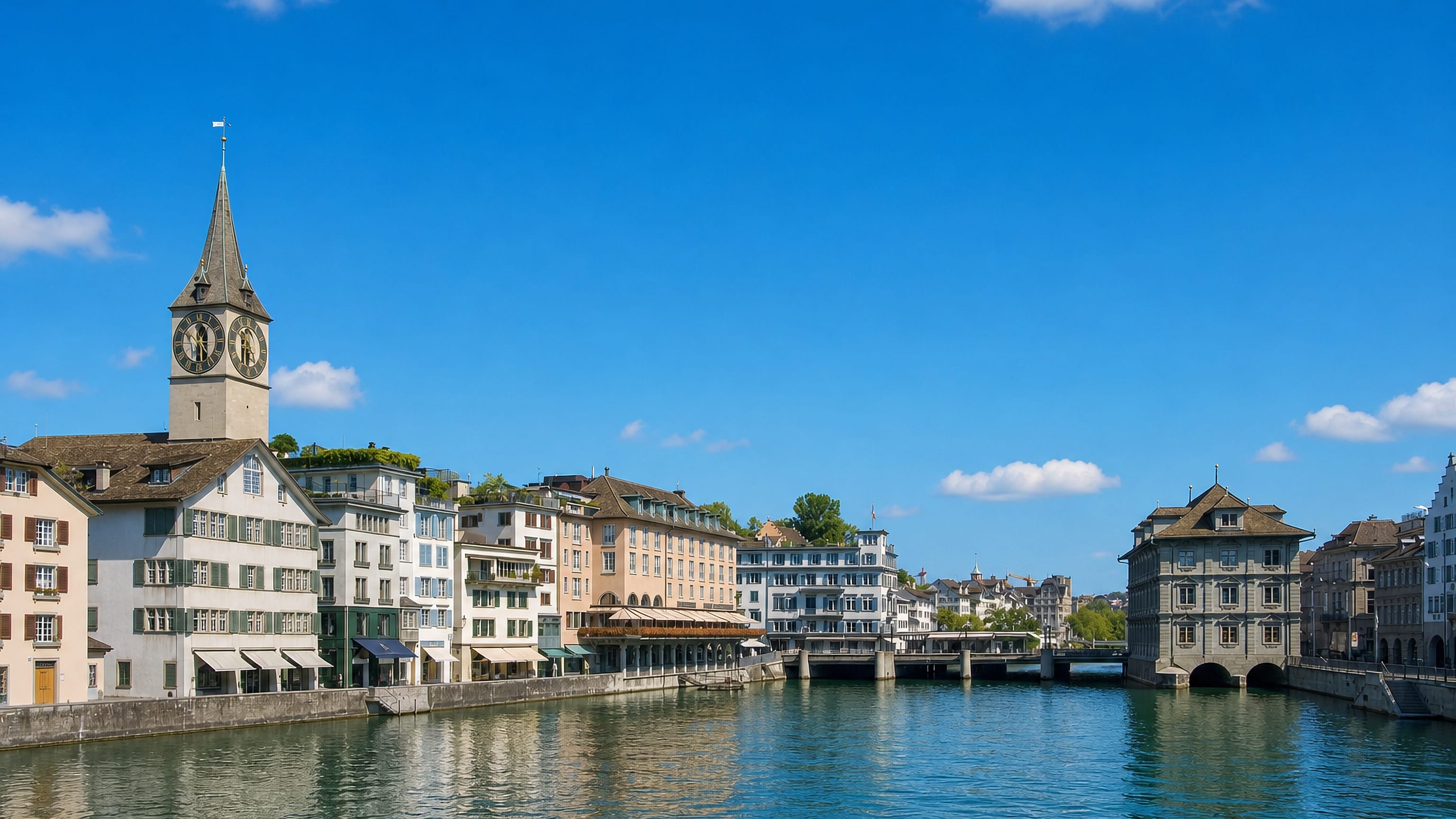 St. Peter's clock tower above the Schipfe houses on the Limmat in Zurich's Lindenhof quarter, Kreis 1.