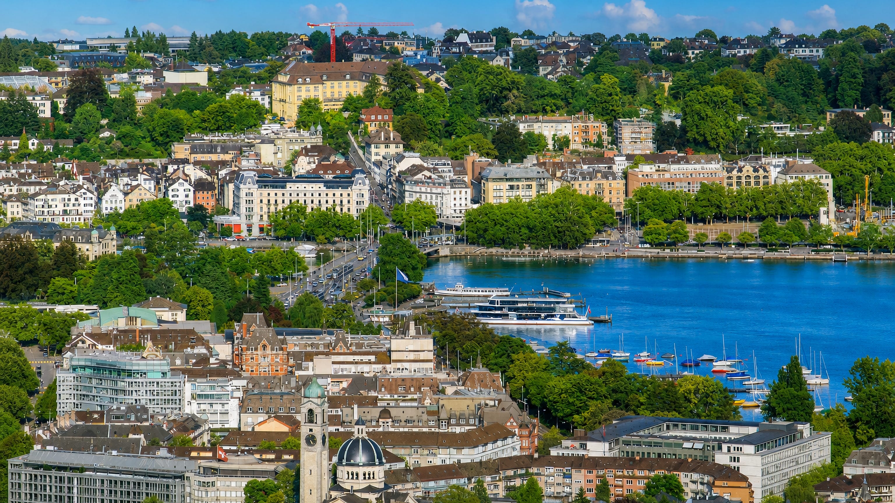Zurich's Enge district (Kreis 2) above Lake Zurich, with the domed Enge church, lakeside quays and moored boats.
