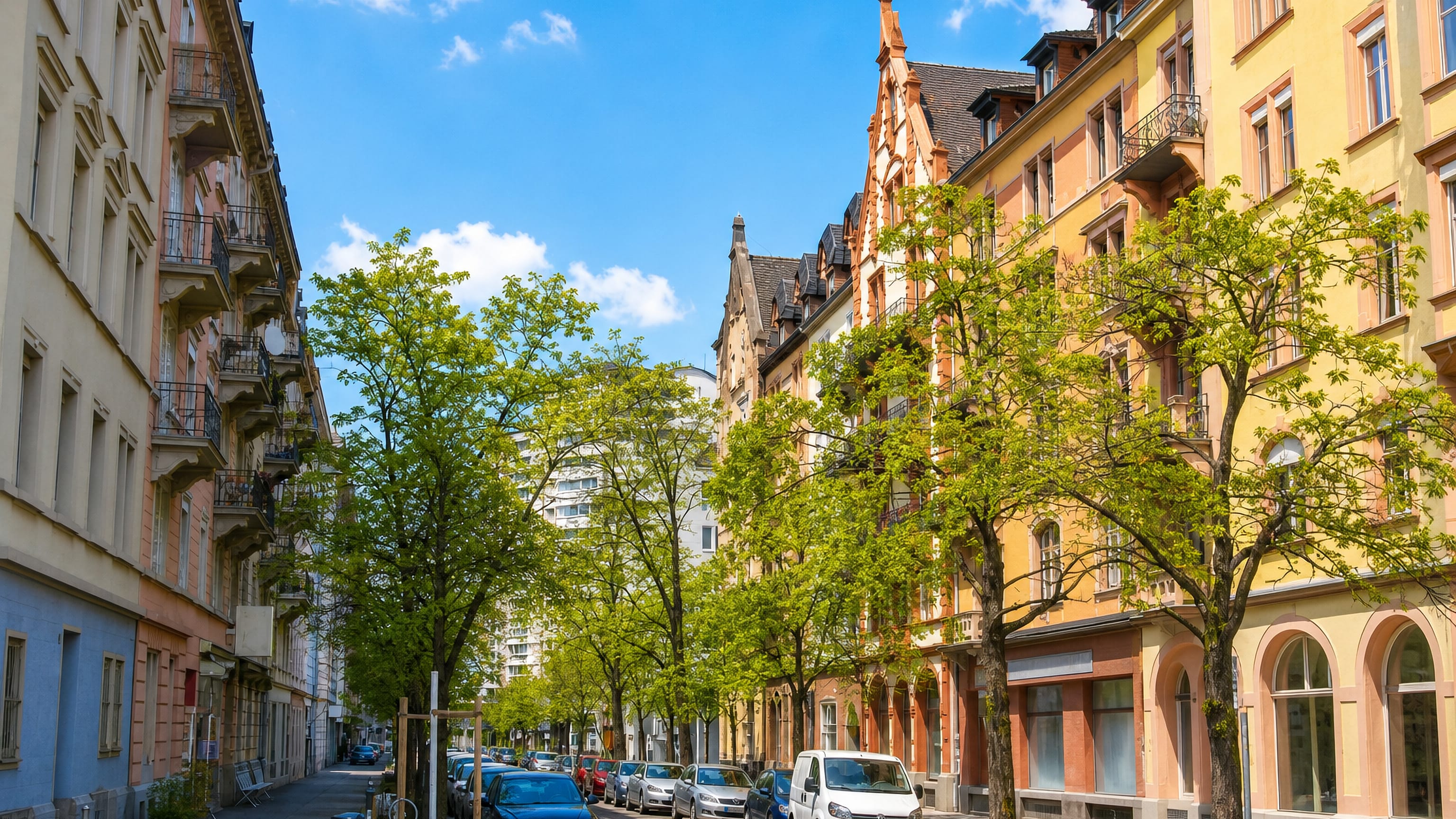 Tree-lined street of 19th-century apartment houses in Zurich Kreis 3, Sihlfeld.