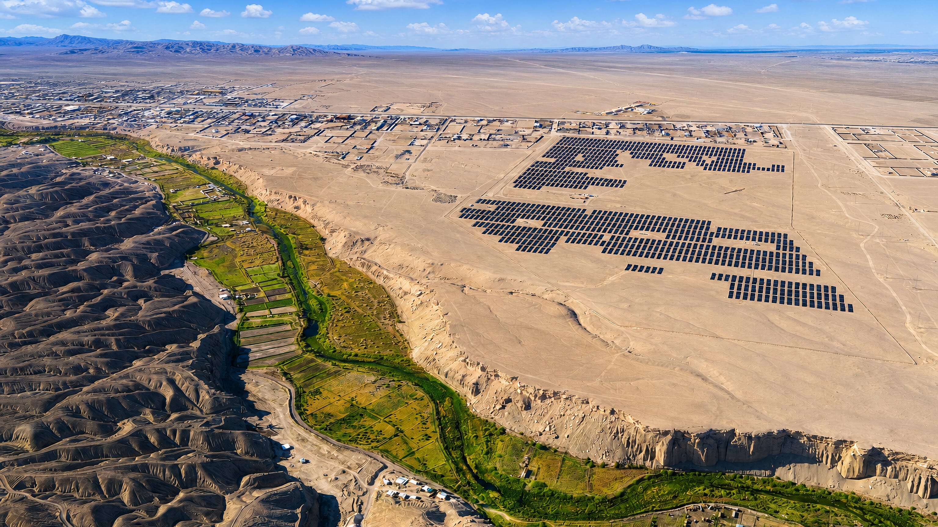 Calama, Chile, on the Atacama plain, where the green Loa River oasis cuts the desert beside a large solar farm.