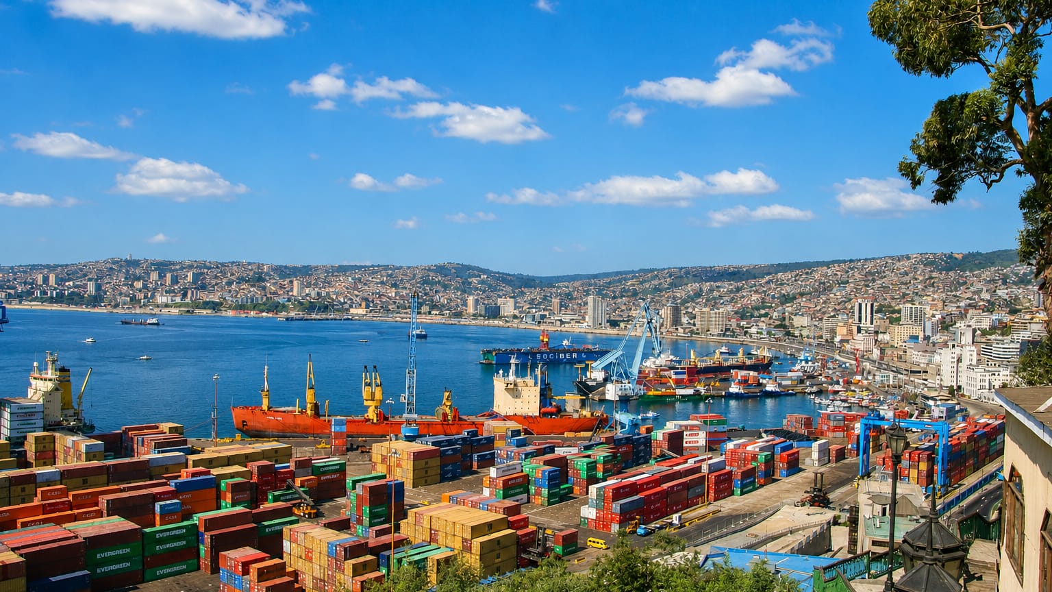 The busy container port and hillside houses ringing the bay of Valparaiso, Chile.