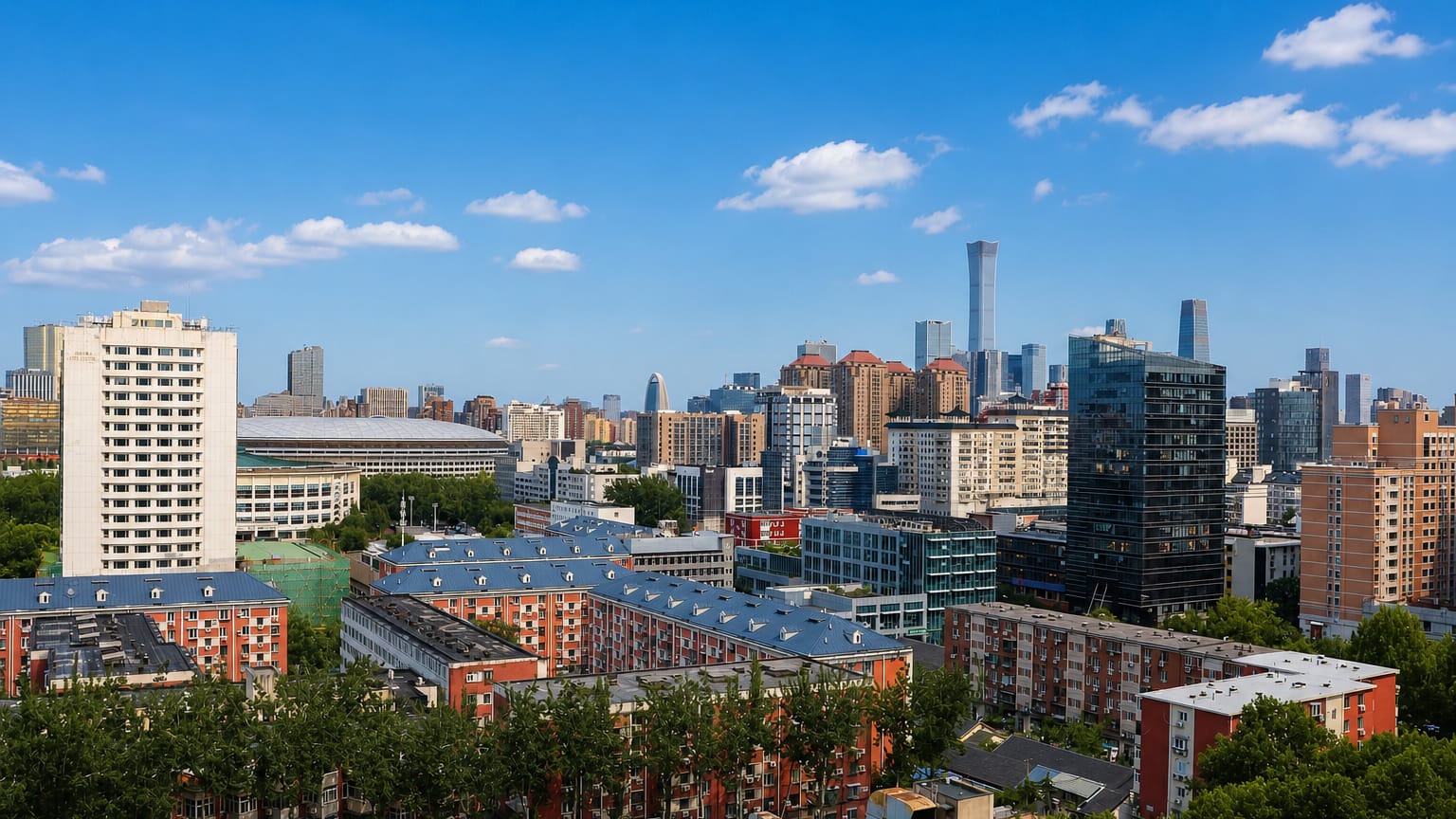 Beijing skyline with the CBD towers rising beyond red-roofed residential blocks, seen from Dongcheng District.