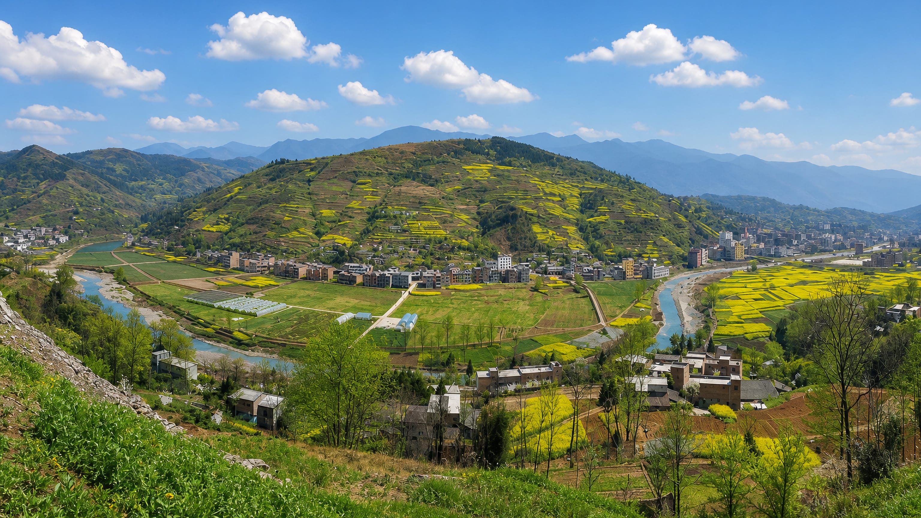 Rapeseed fields and a river winding past a small riverside town in Wushan County, Chongqing