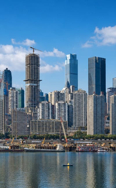 Chongqing's Yuzhong peninsula skyline of dense high-rises rising above the river confluence