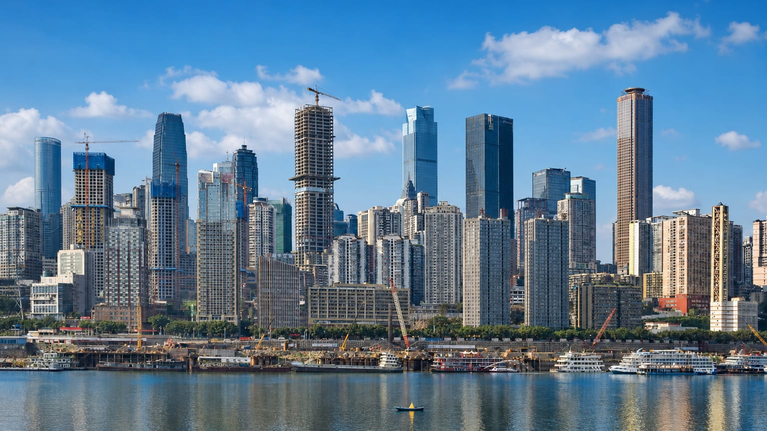 Chongqing's Yuzhong peninsula skyline of dense high-rises rising above the river confluence