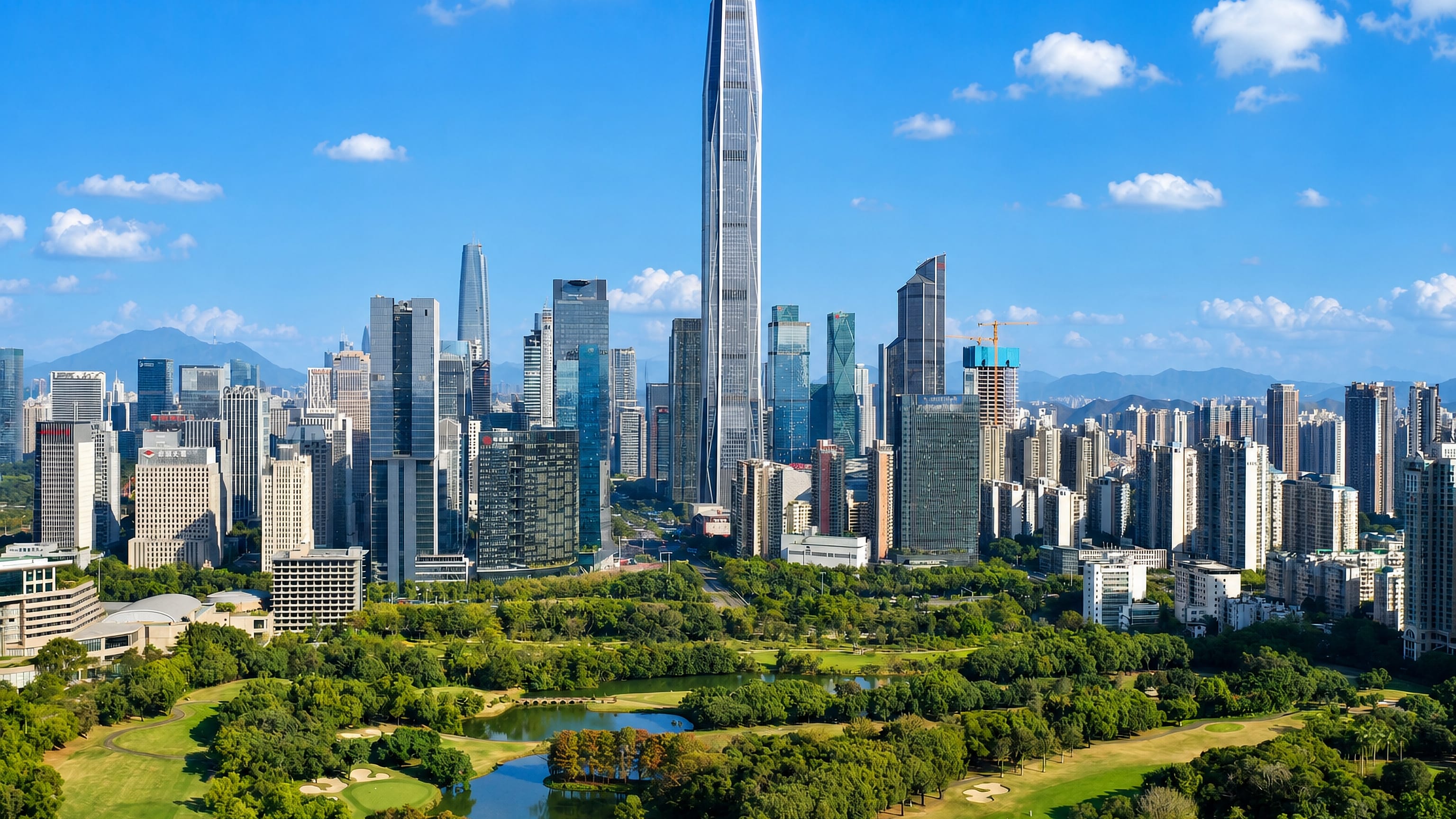 Futian, Shenzhen: the Ping An Finance Centre towering over the CBD skyline above a green park and lake.