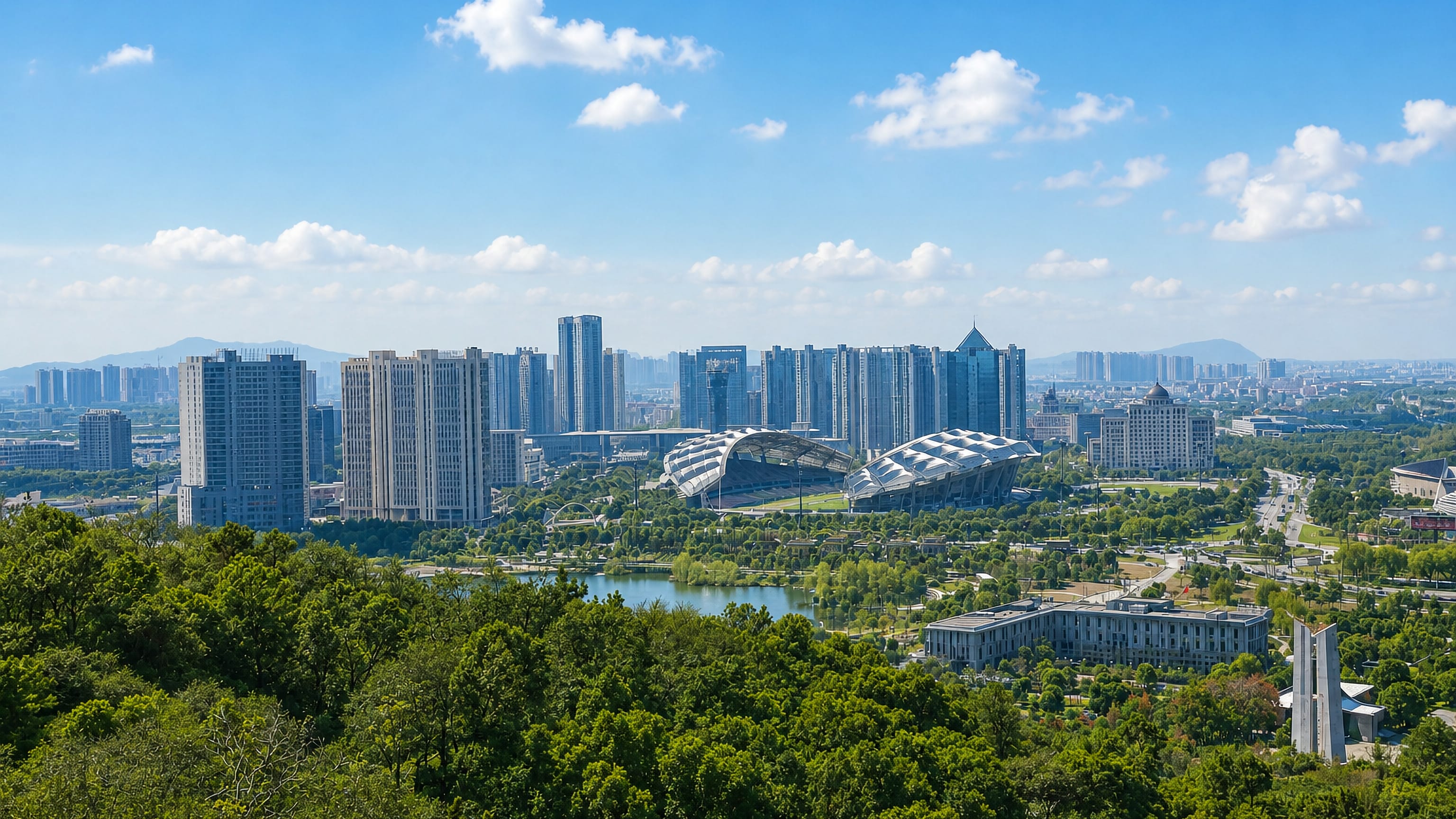 Skyline of Jiangyin, Jiangsu, seen over wooded parkland, with residential towers and a curved sports arena