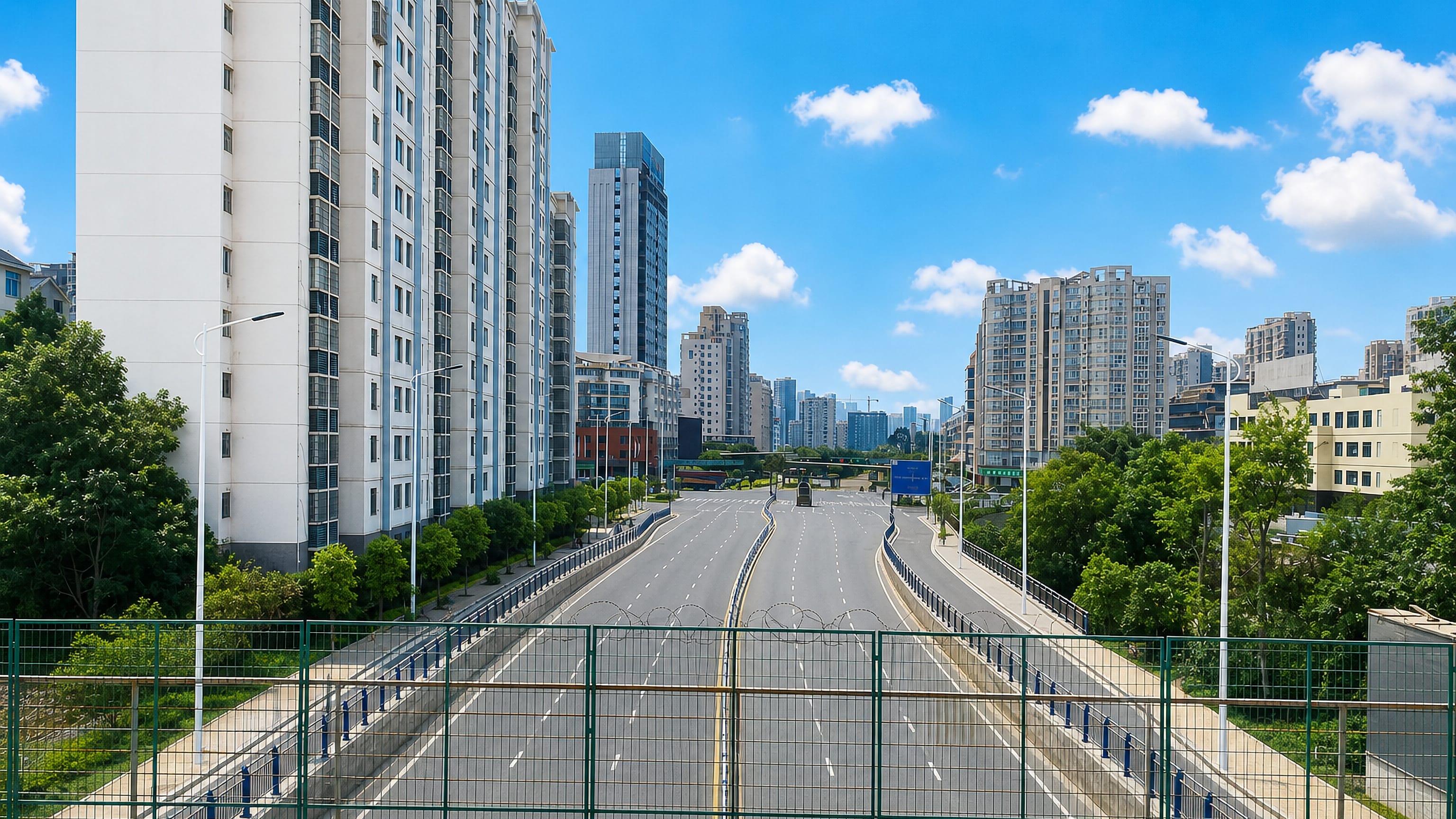 A broad avenue running between high-rise residential towers in Ganzhou, Jiangxi, China.