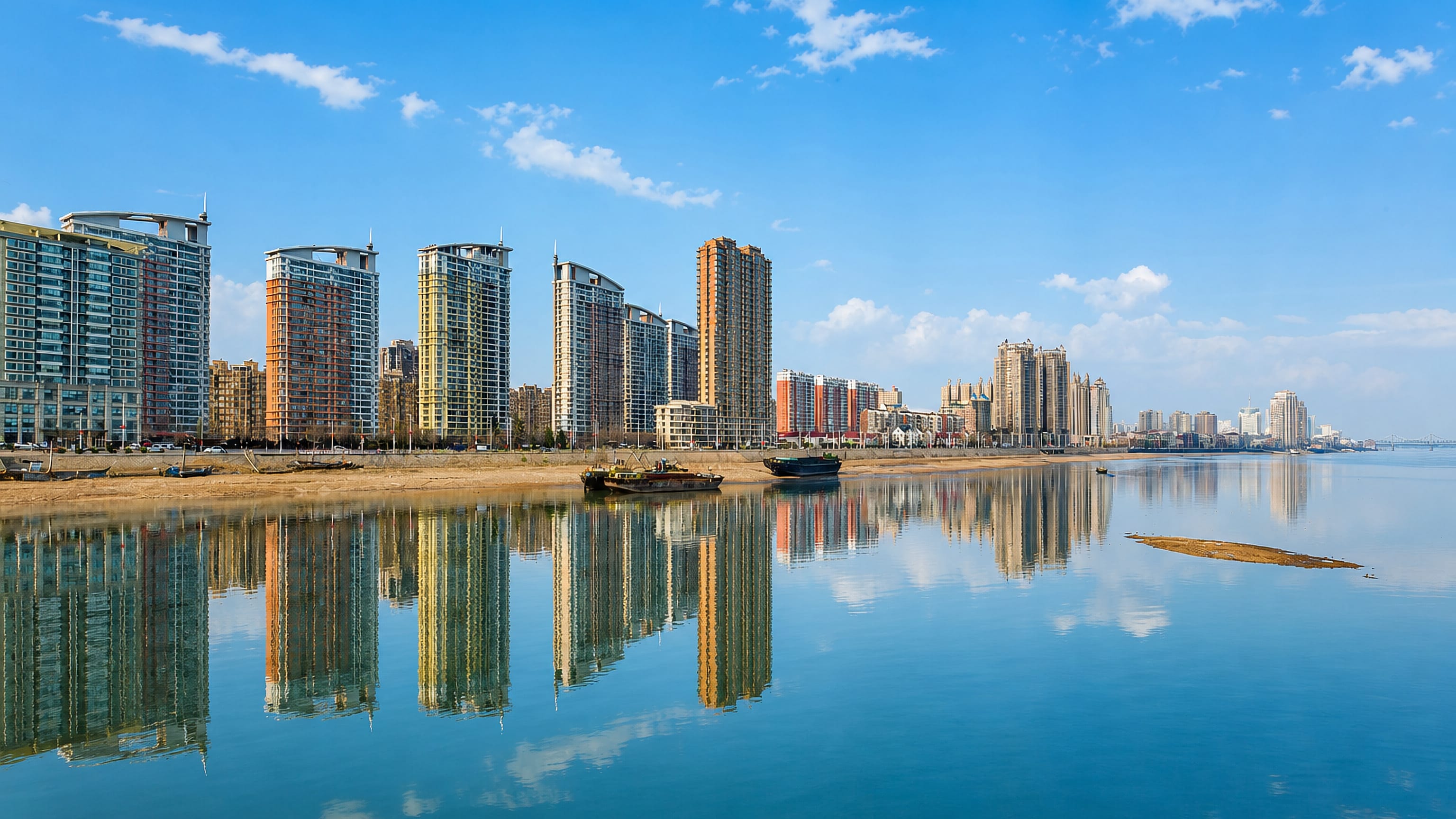 High-rise towers along the Yalu River waterfront in Zhenxing district, Dandong.