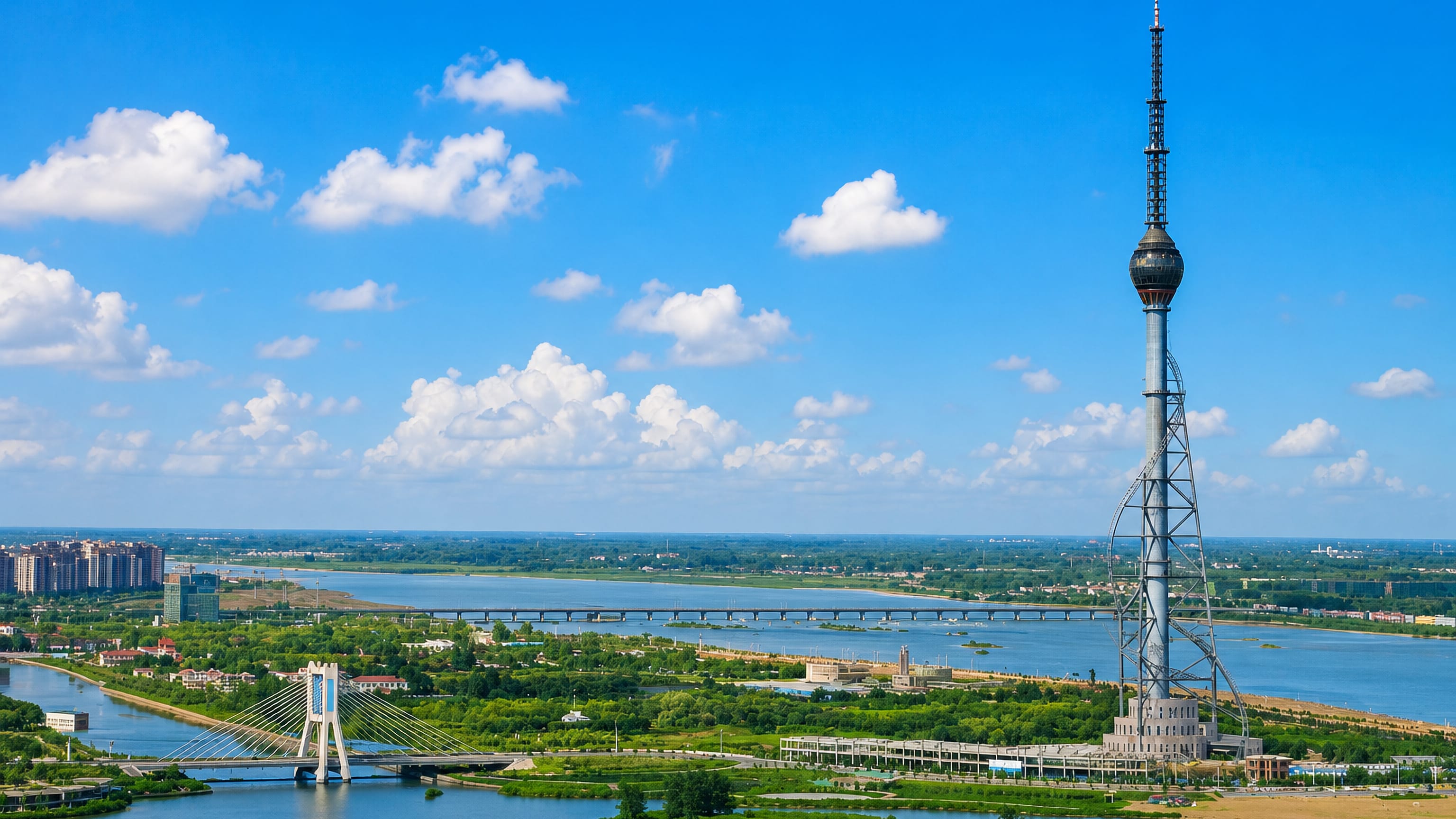 Television tower, cable-stayed bridge and the broad Yi River crossing Linyi in Shandong, China.