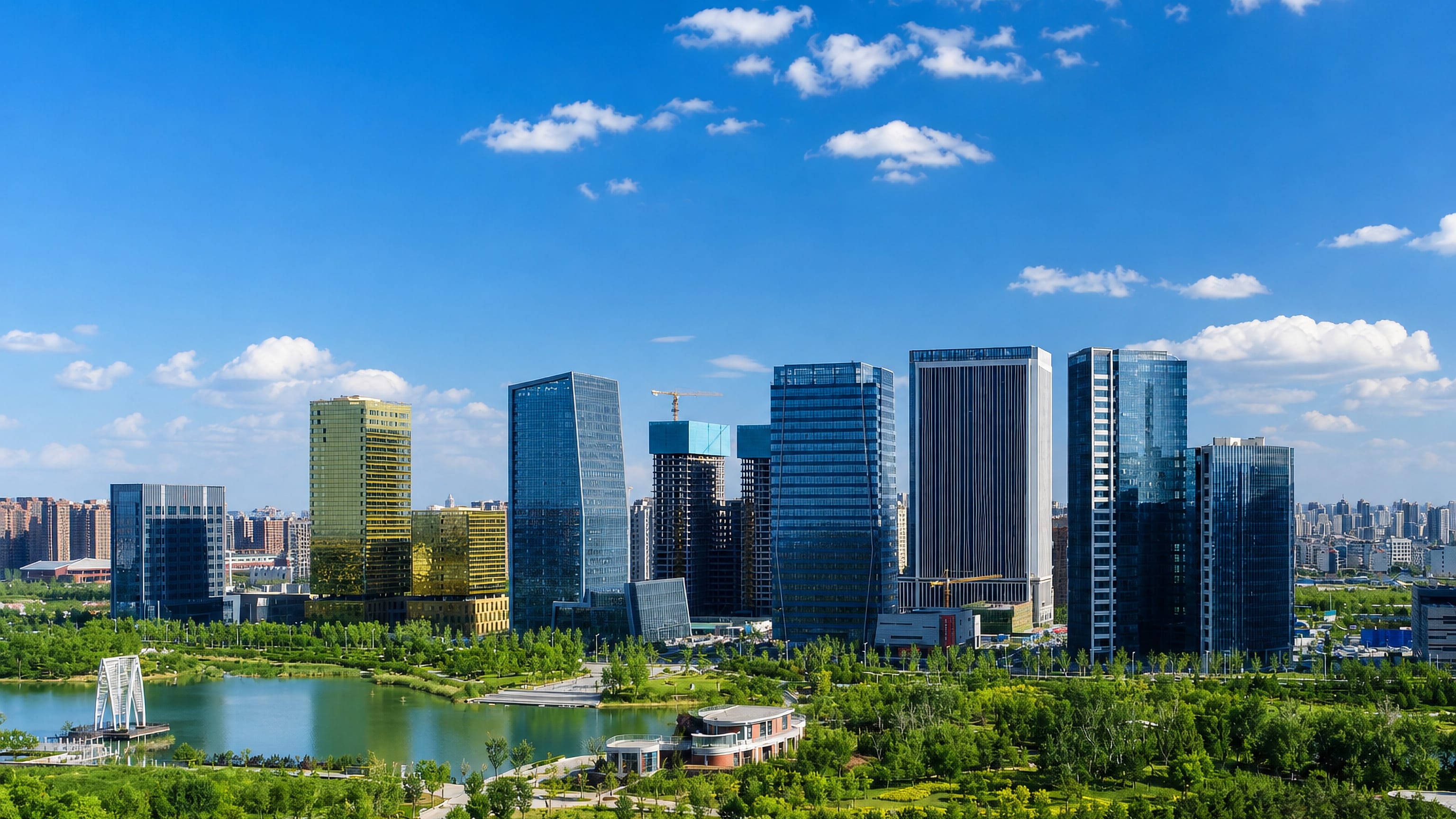 Modern high-rise business district of Zibo, Shandong, rising above a landscaped park and lake.