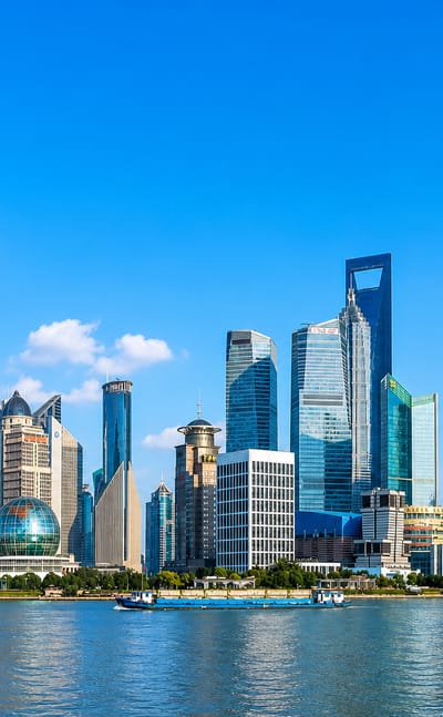 The Pudong skyline with the Oriental Pearl Tower, Shanghai Tower and World Financial Center across the Huangpu River in Shanghai.