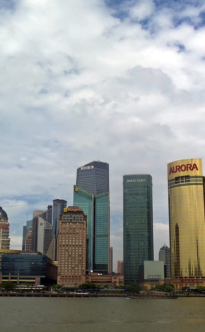 The Lujiazui skyline seen from the Huangpu waterfront in Shanghai, with the Oriental Pearl Tower and riverside towers