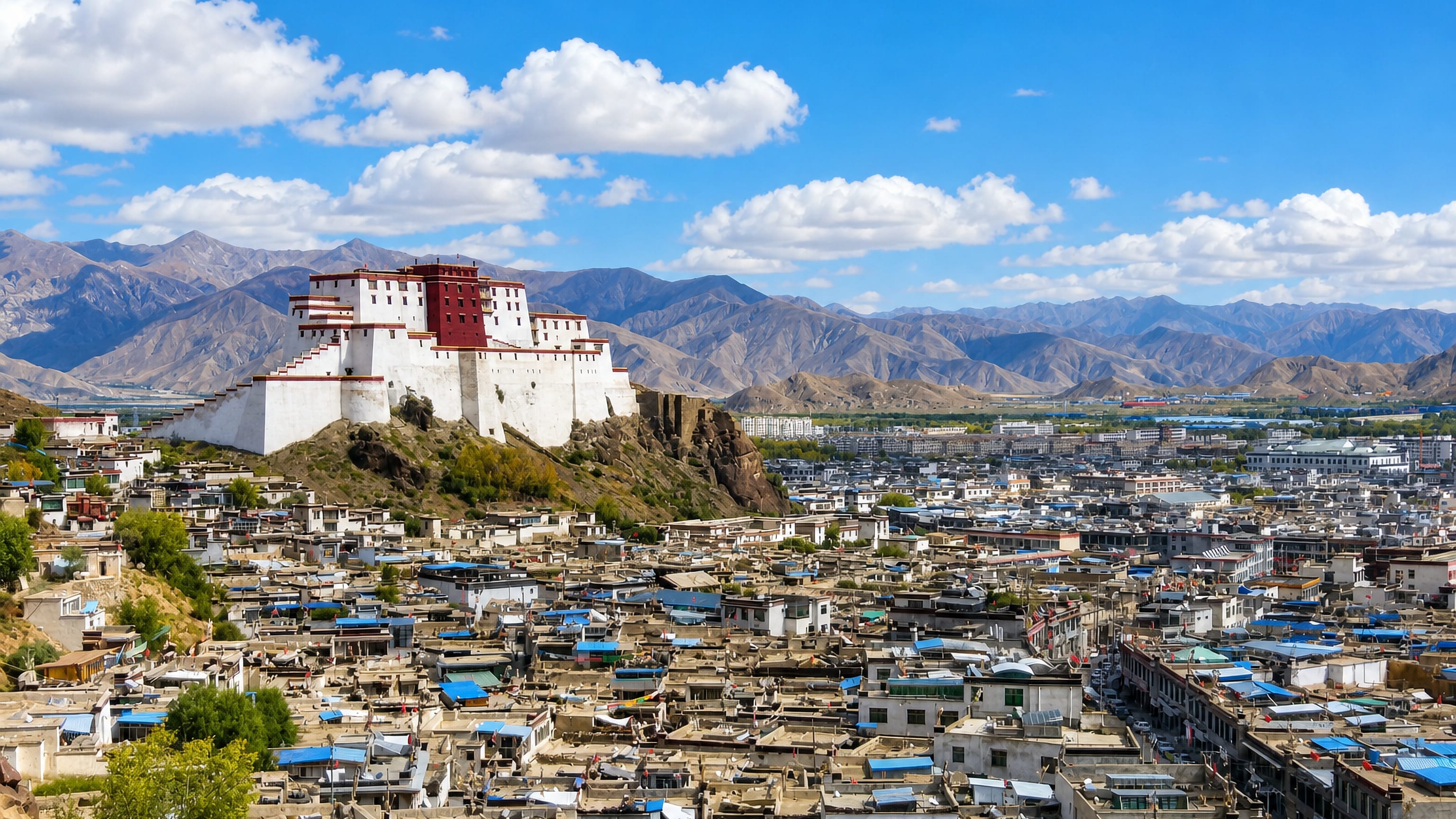 The white-and-red Shigatse Dzong fortress rising above the old-town rooftops of Rikaze, Tibet