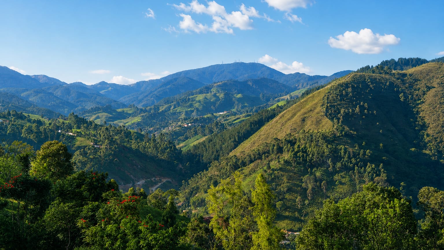 Green mountainous valley with forested hills near the San Antonio de Prado corregimiento of Medellin, Colombia.