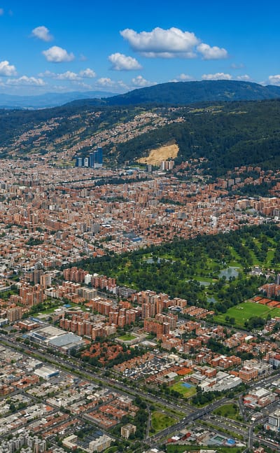 Aerial view over the northern Usaquen district of Bogota with a green park and the Eastern Hills behind