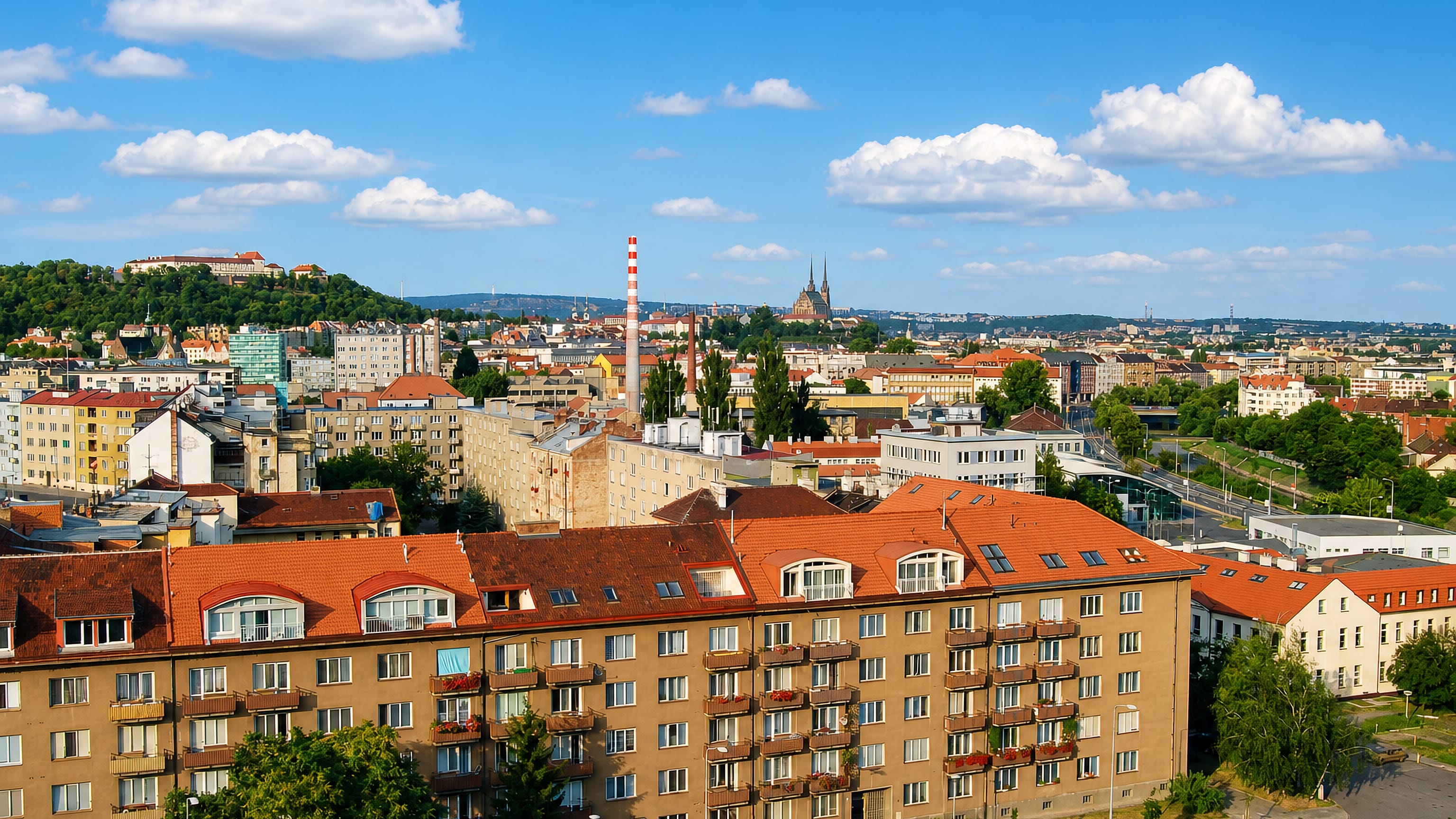 Špilberk Castle and Petrov Cathedral rising above red-tiled apartment blocks in Staré Brno, Brno.