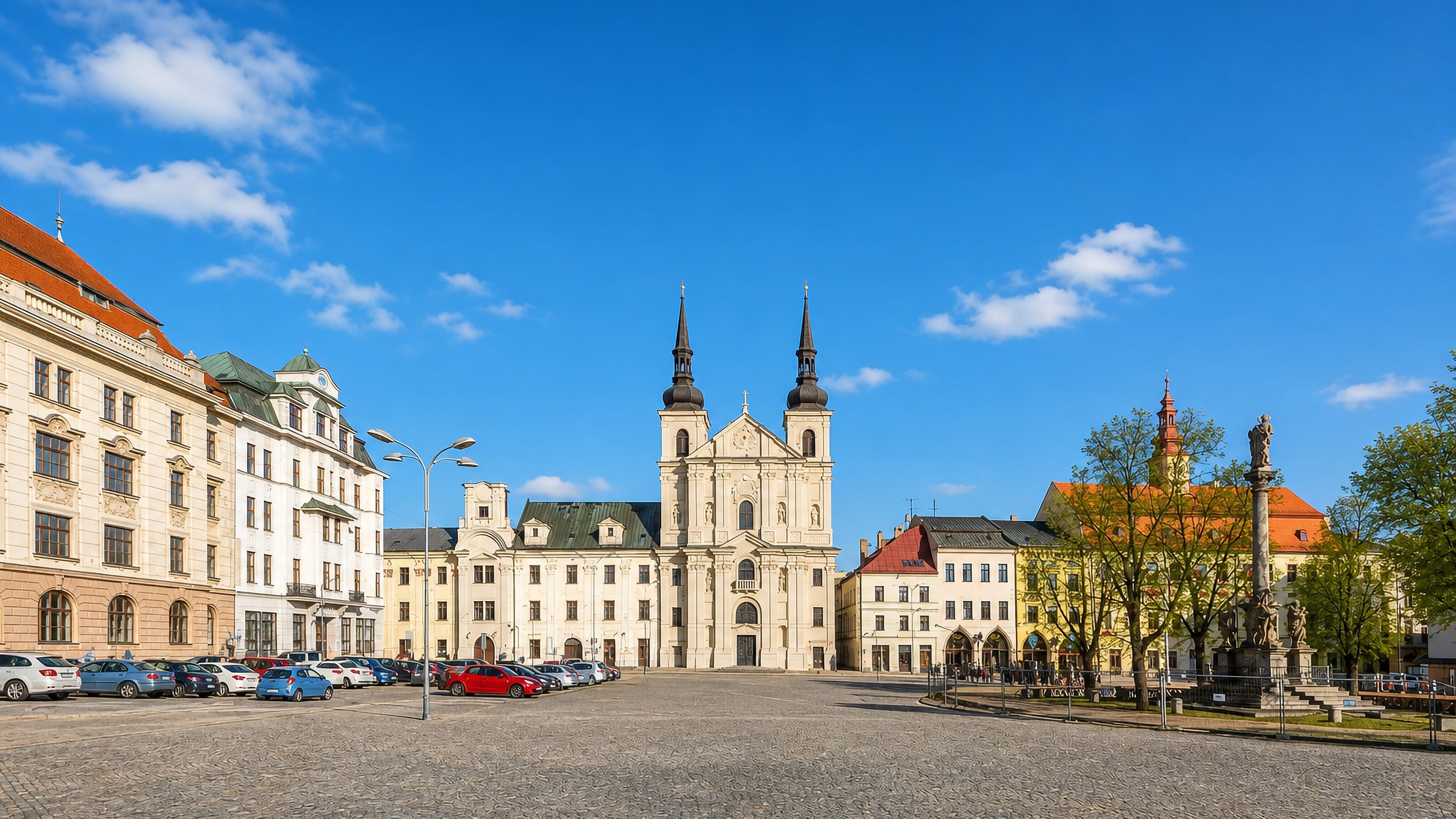 Jihlava's Masaryk Square with the twin-towered Church of St Ignatius of Loyola and the baroque plague column.