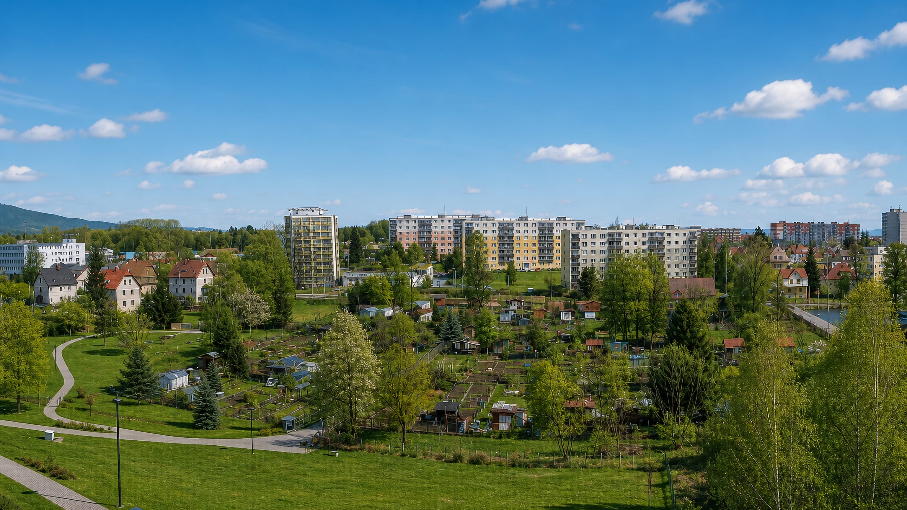 Panel apartment blocks, allotment gardens and parkland in Františkov, a western district of Liberec, Czechia.