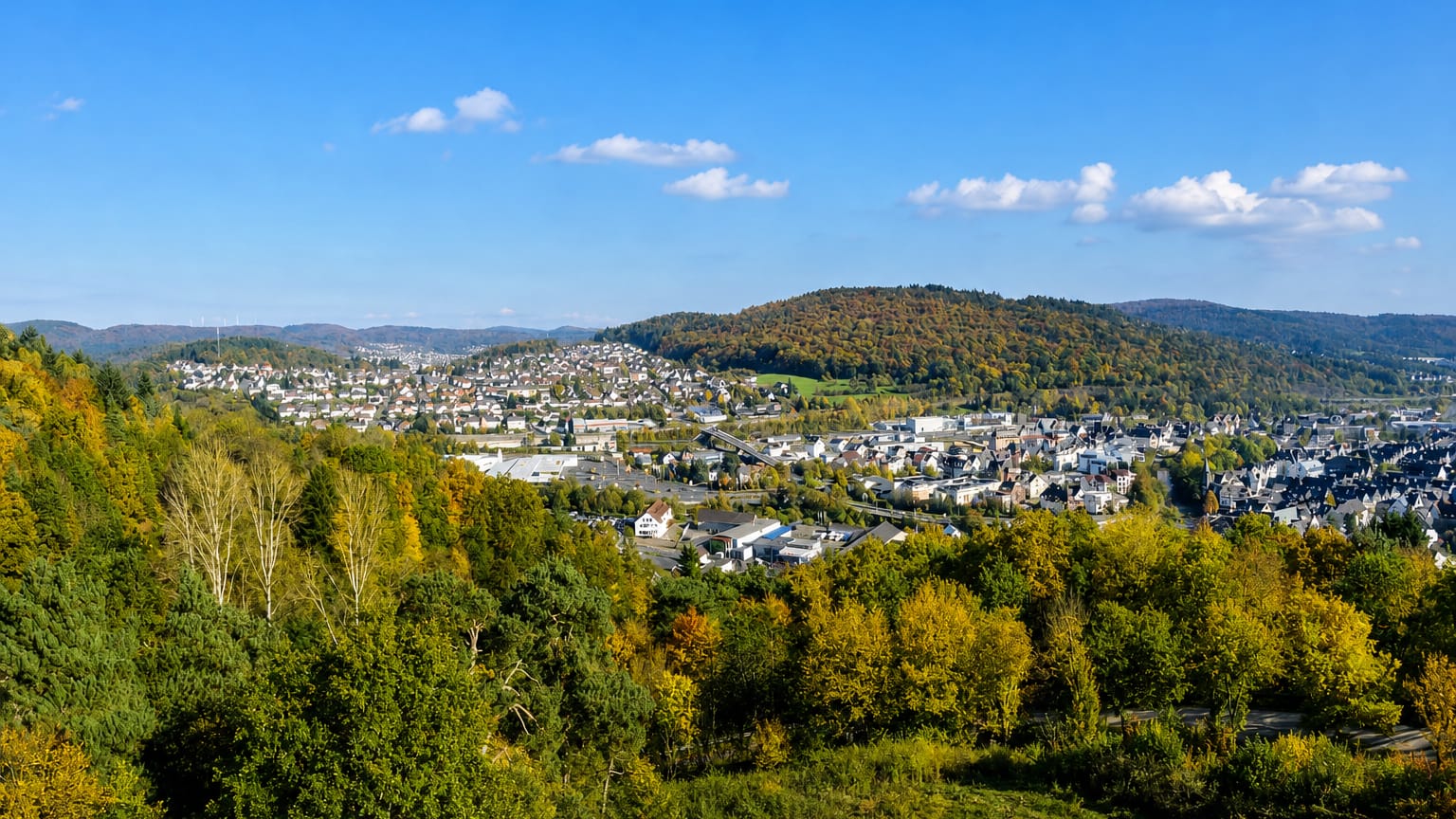 Autumn view over the small town of Alsbach nestled among wooded hills in Hessen