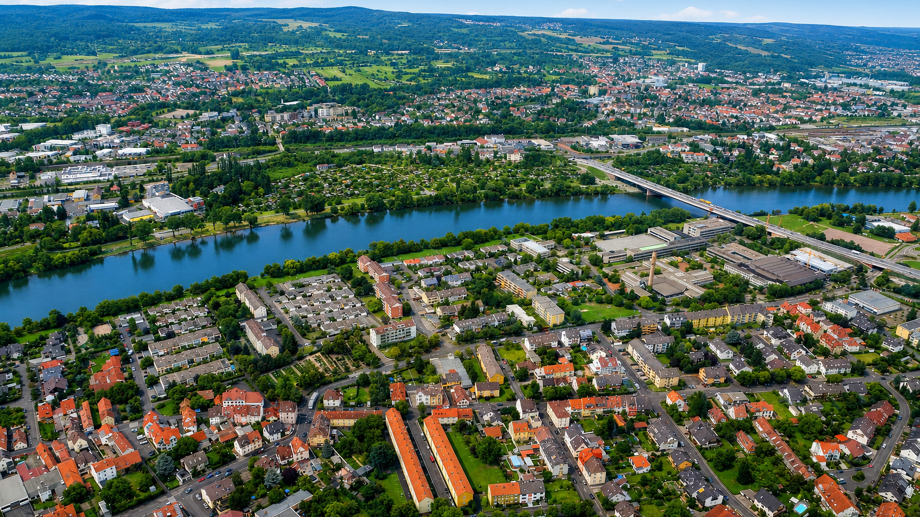 Aerial view over the River Main and its bridge across the Leider district of Aschaffenburg.