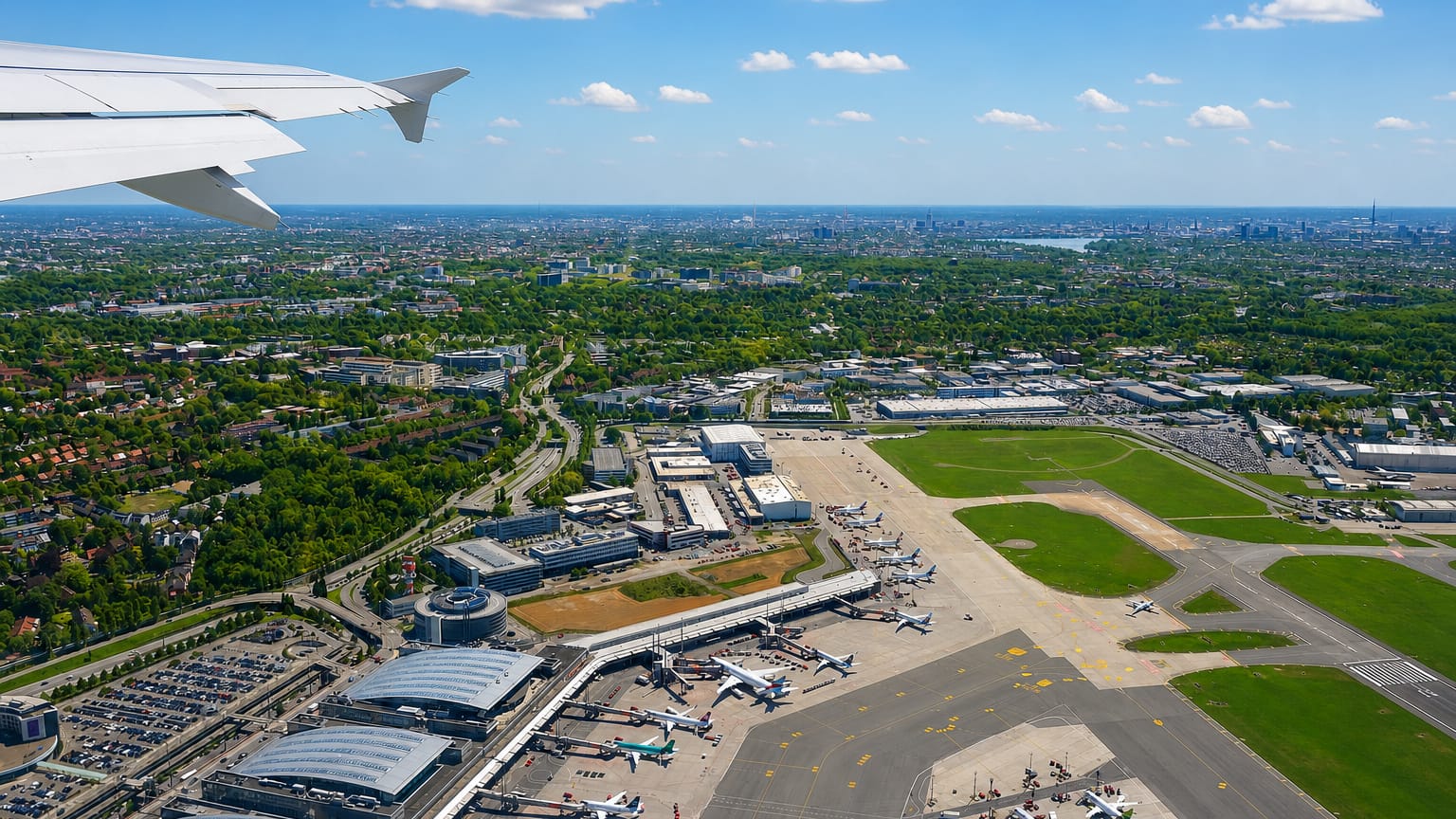Aerial view over Hamburg Airport in the Fuhlsbüttel district, with terminals, aprons and parked aircraft