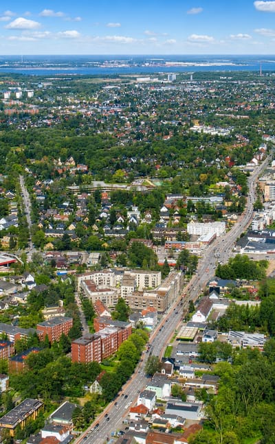 Aerial view of the Lurup district on the western edge of Hamburg with mixed low-rise housing along a main road