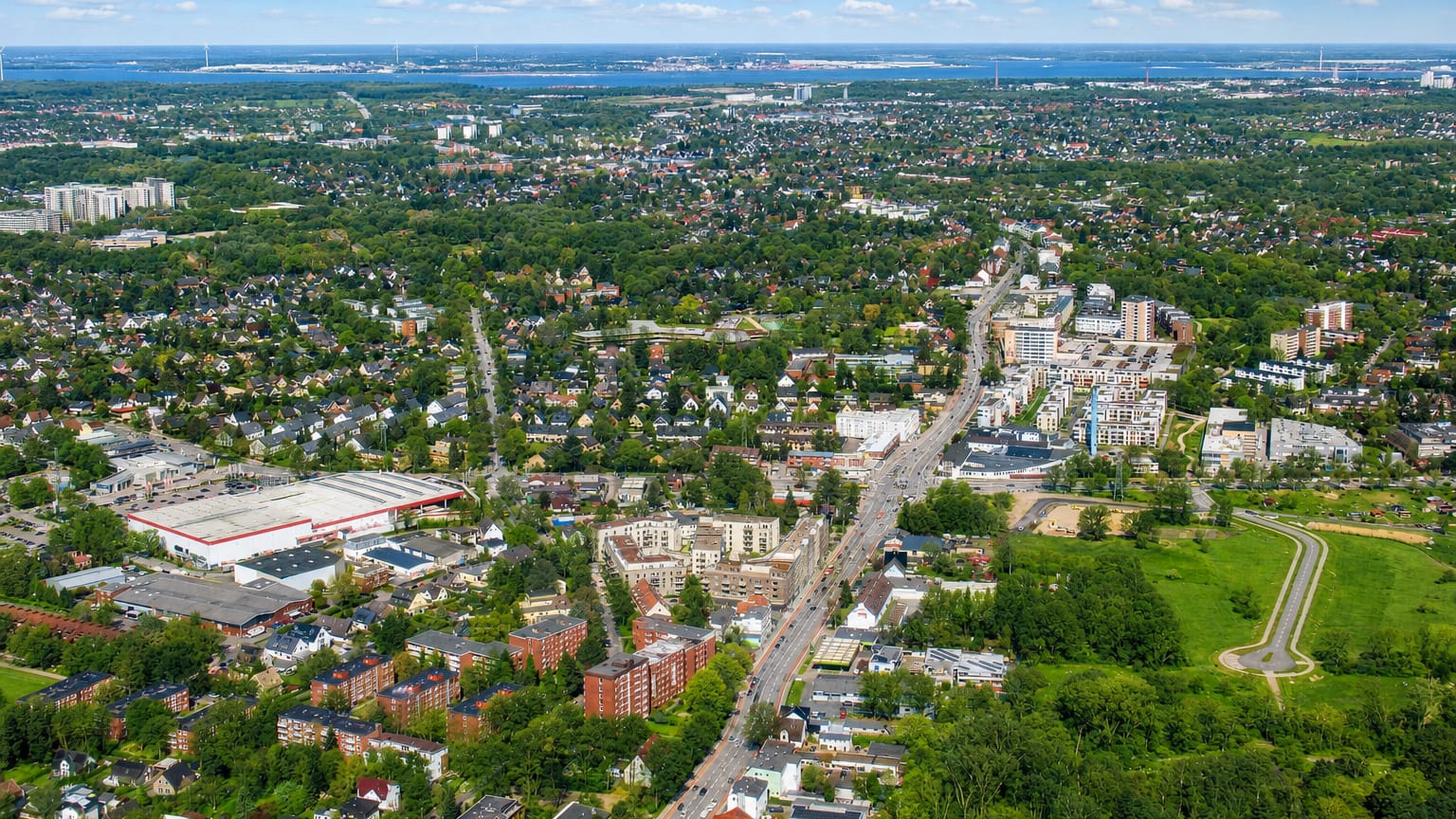 Aerial view of the Lurup district on the western edge of Hamburg with mixed low-rise housing along a main road