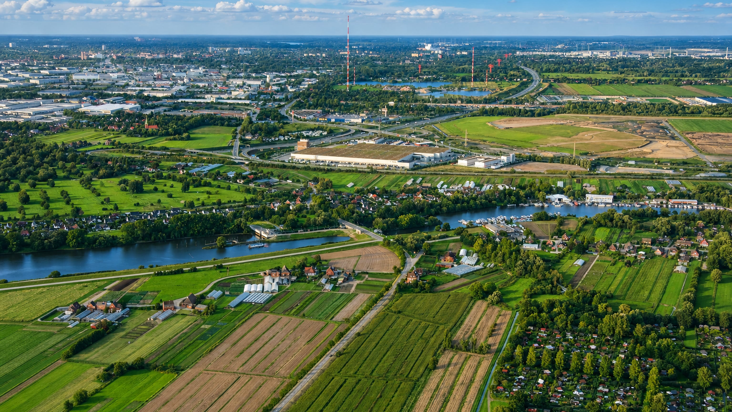 Aerial view of Tatenberg's market gardens, polder fields and Dove Elbe marina on Hamburg's southeastern edge