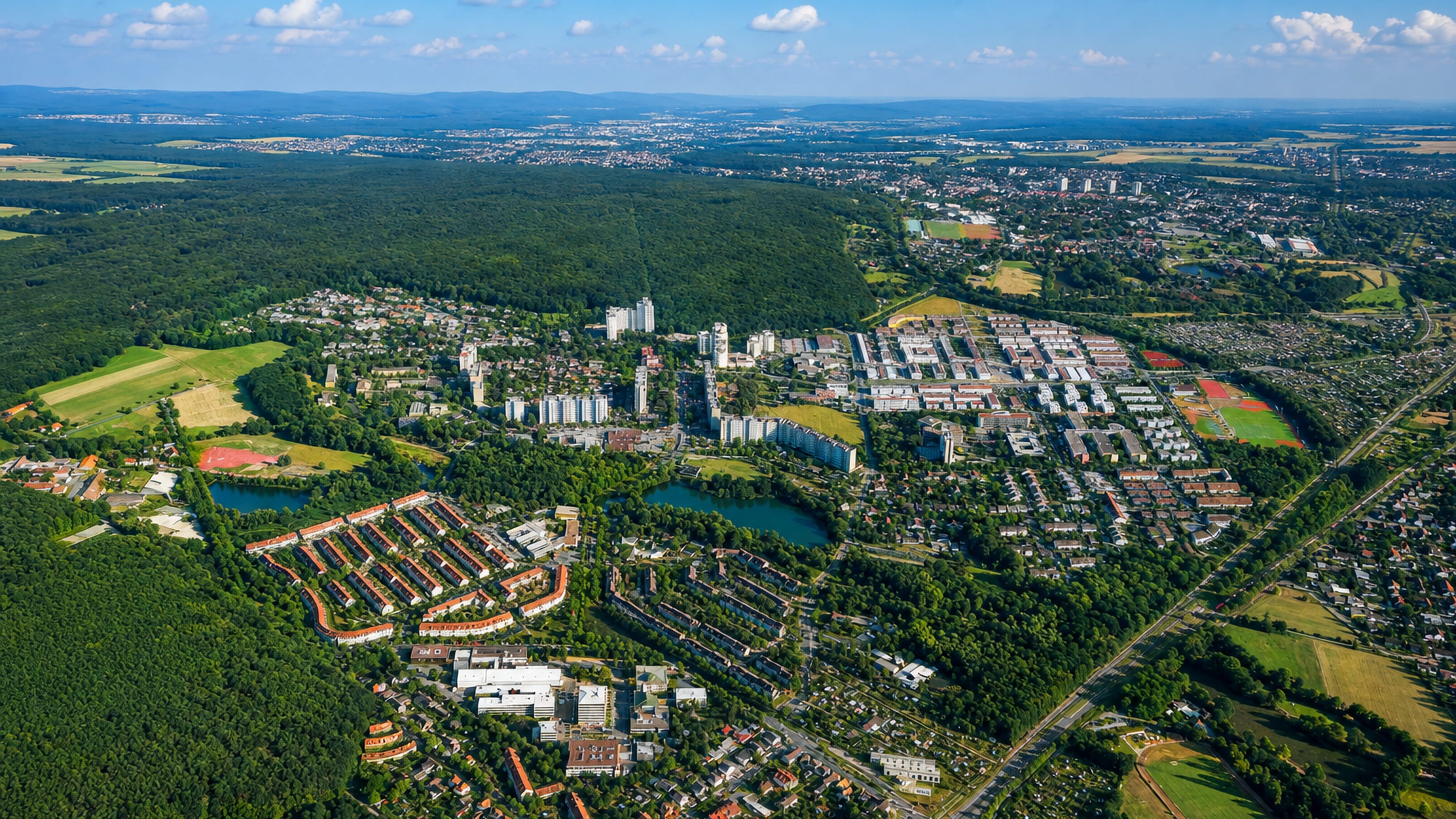 Aerial of Kranichstein's forest-ringed housing estate and lake on the edge of Darmstadt.