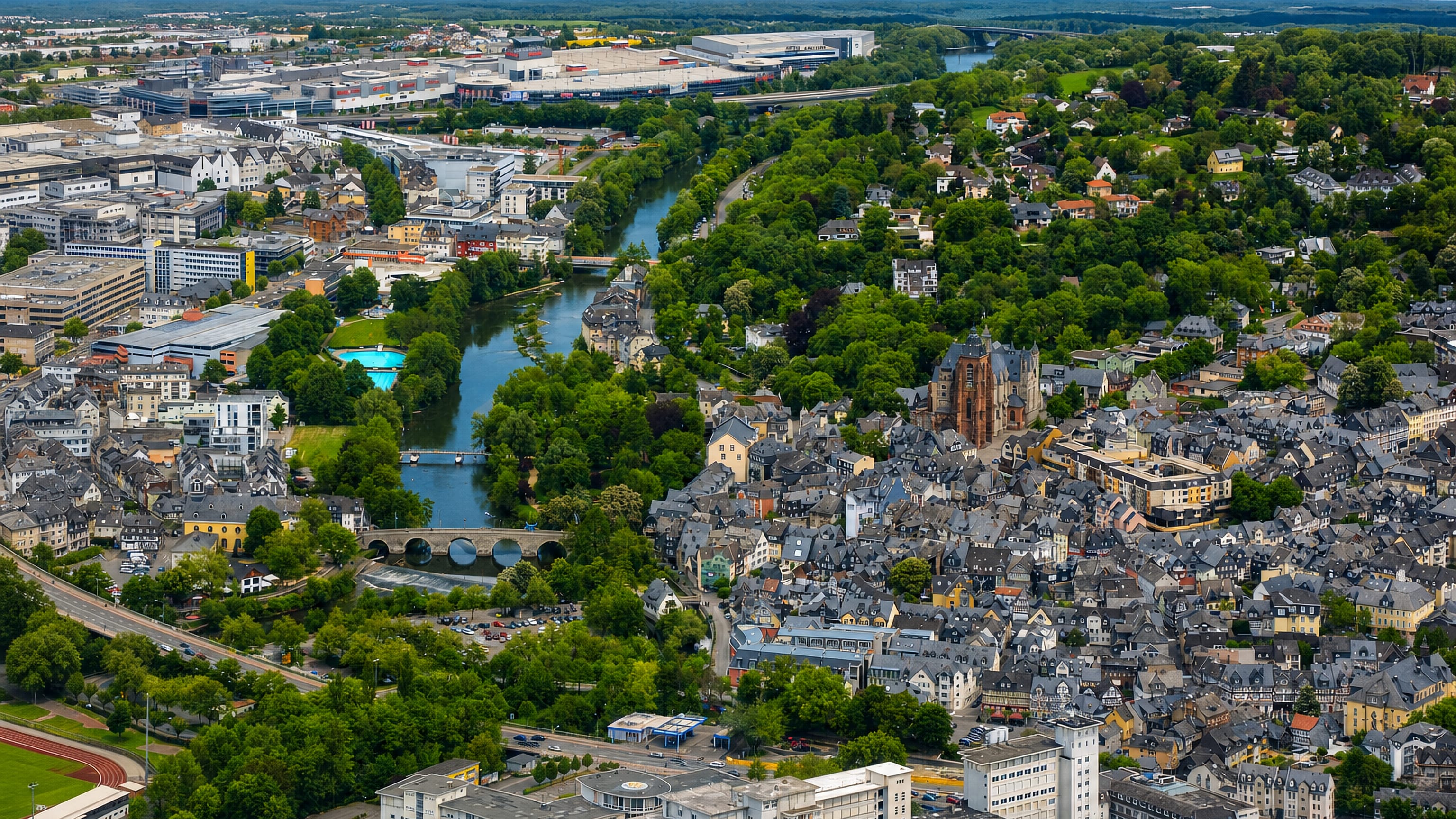 Aerial view of Wetzlar, Germany, with the Lahn river, its medieval stone bridge and the cathedral above the old town.