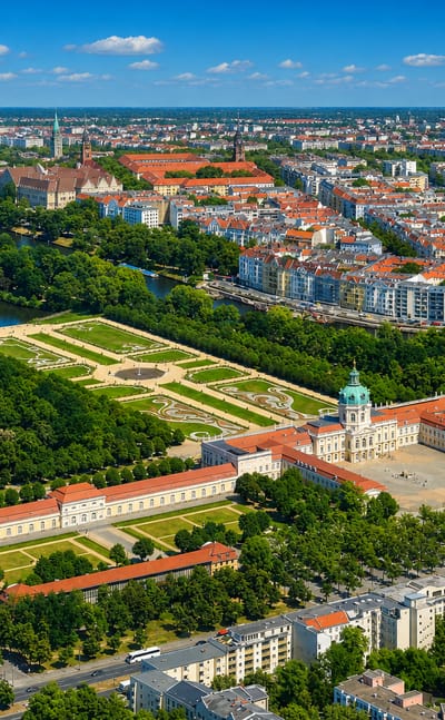 Aerial view of Charlottenburg Palace and its baroque gardens amid the red-roofed Berlin cityscape in Charlottenburg