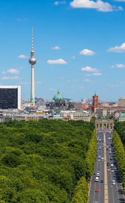 Berlin skyline from the Tiergarten with the TV Tower, Berliner Dom, Reichstag dome and the boulevard through the park.