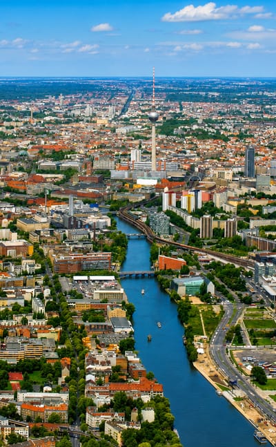 Aerial view of Berlin's Treptow along the Spree river with the Fernsehturm TV tower on the skyline