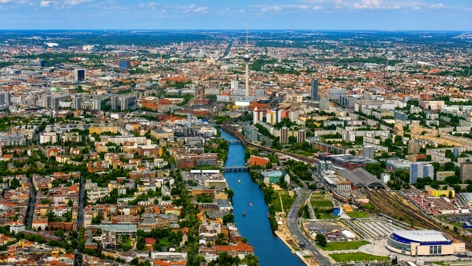 Aerial view of Berlin's Treptow along the Spree river with the Fernsehturm TV tower on the skyline