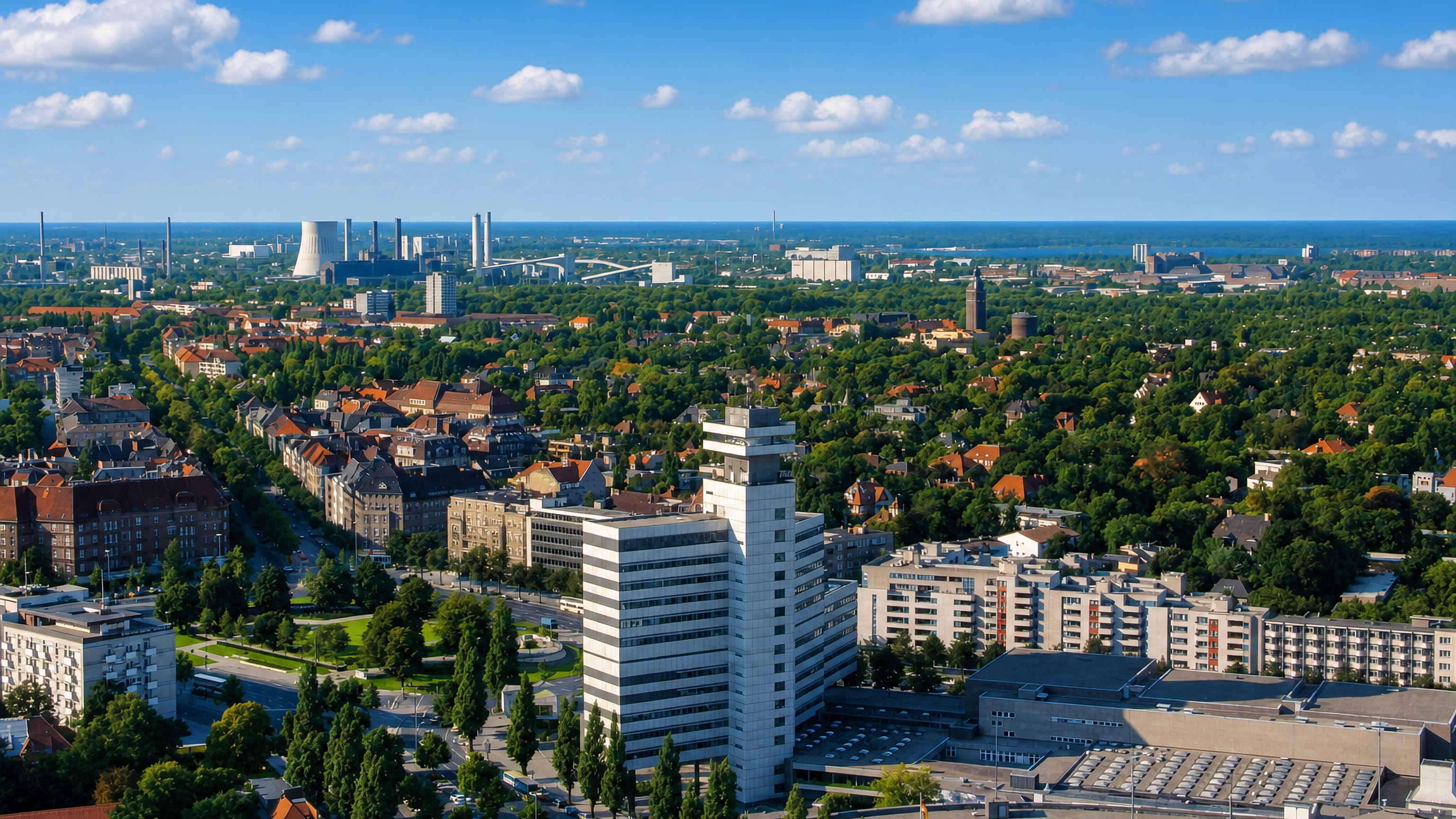 Aerial view over Westend in Berlin, with leafy villa streets, a white modernist tower and exhibition halls
