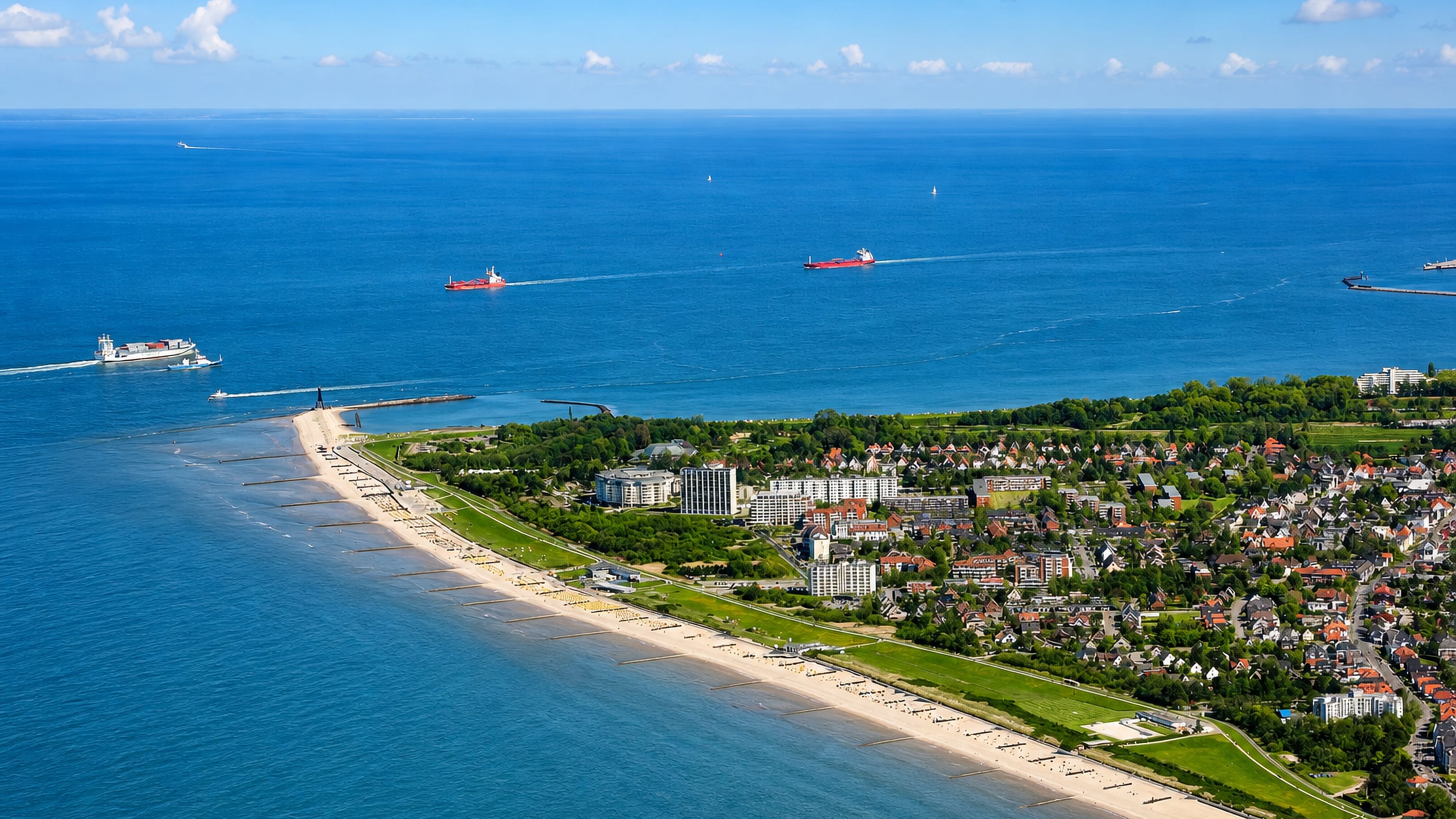 Aerial view of Döse in Cuxhaven, its long sandy beach and dyke facing the Elbe estuary shipping lane