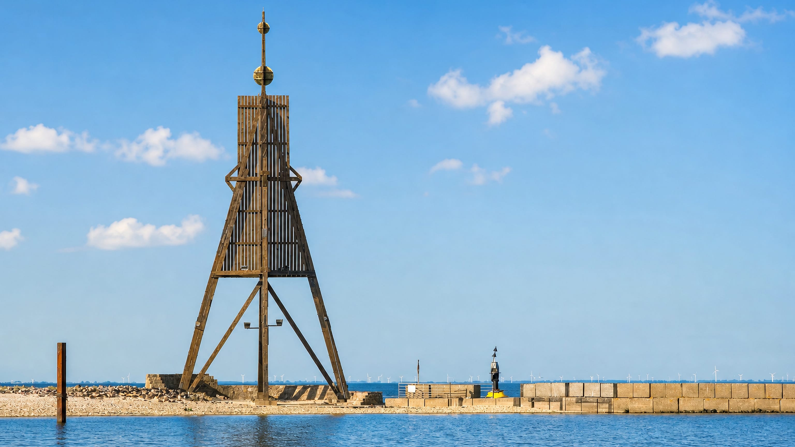 The wooden Kugelbake beacon on the breakwater at Cuxhaven, where the Elbe meets the North Sea.