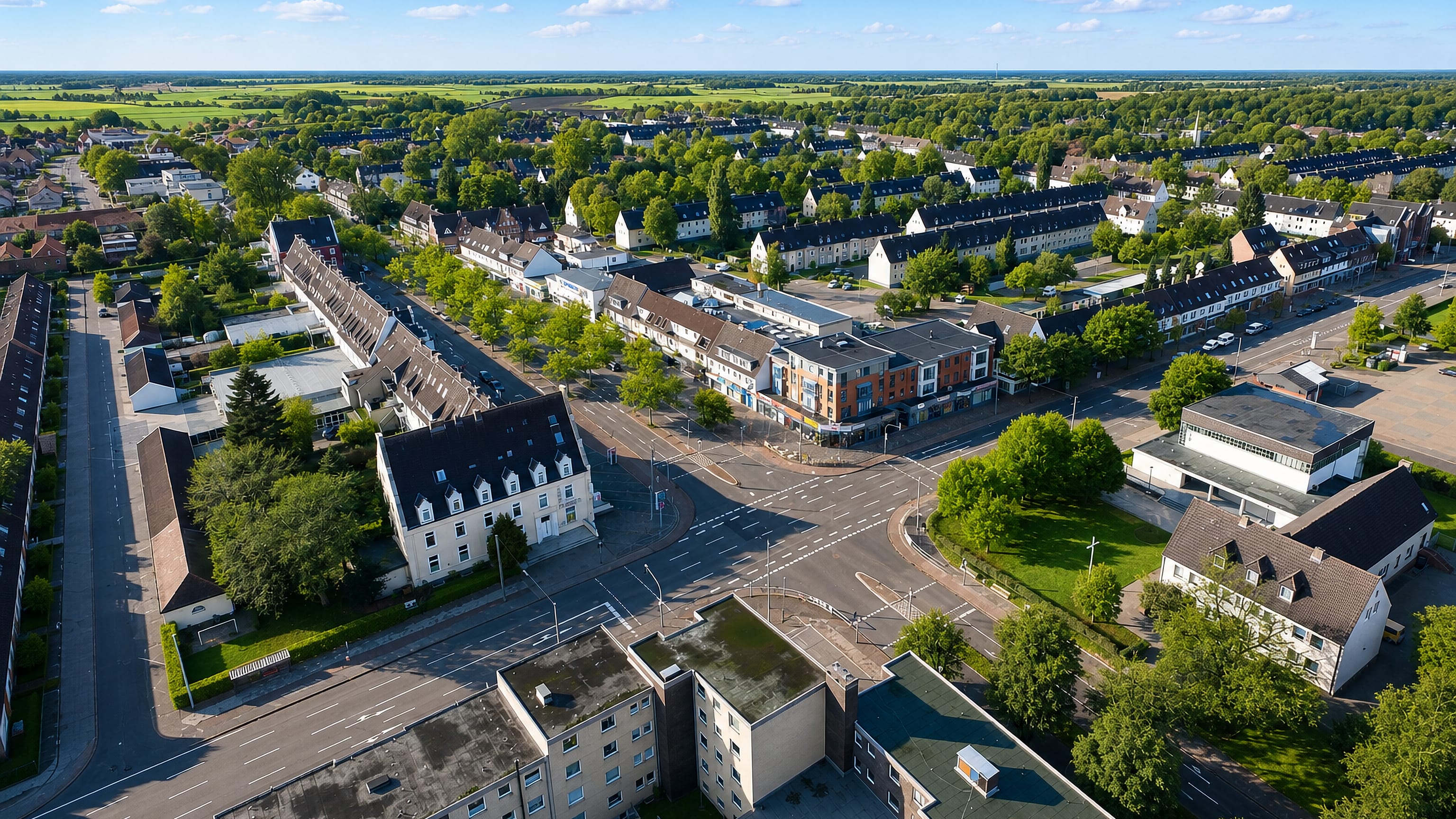 Aerial view of terraced housing and the main crossroads of Fedderwardergroden in Wilhelmshaven.
