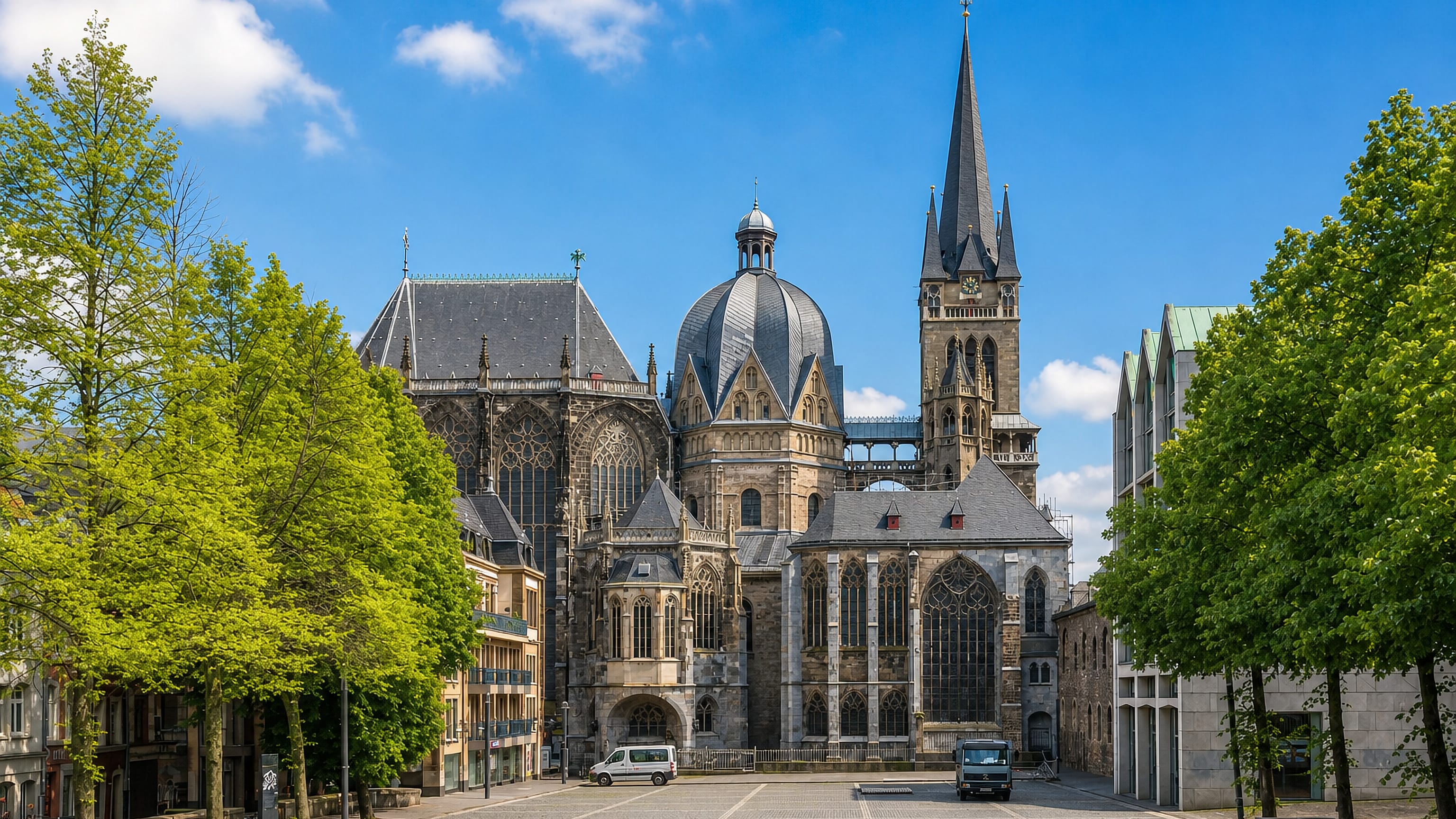 Aachen Cathedral with its octagonal dome and Gothic spire seen from the plaza in Aachen-Mitte, Germany.