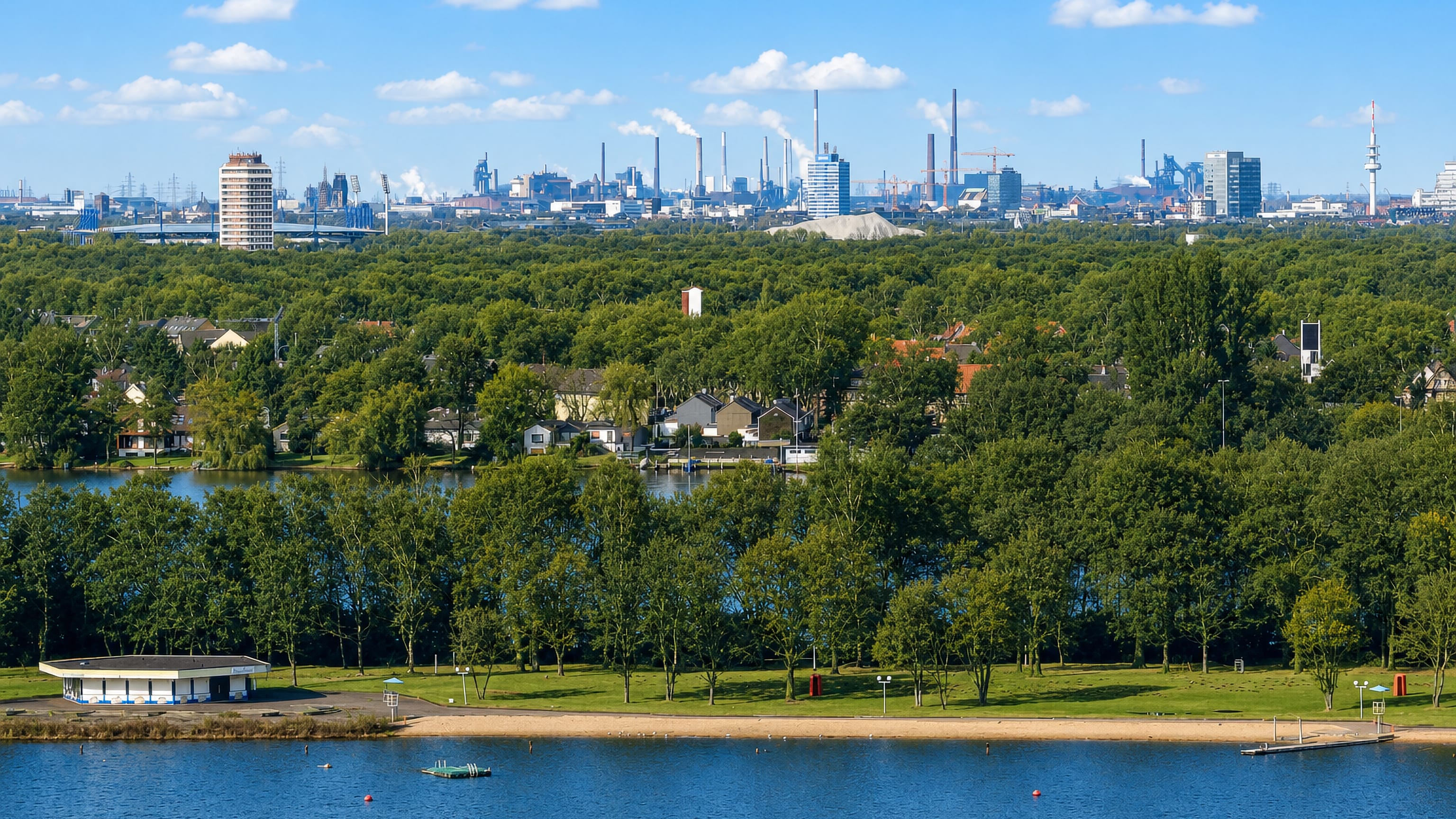 Wedau, Duisburg: a lake beach and wooded shore backed by the city's industrial skyline of chimneys and towers.