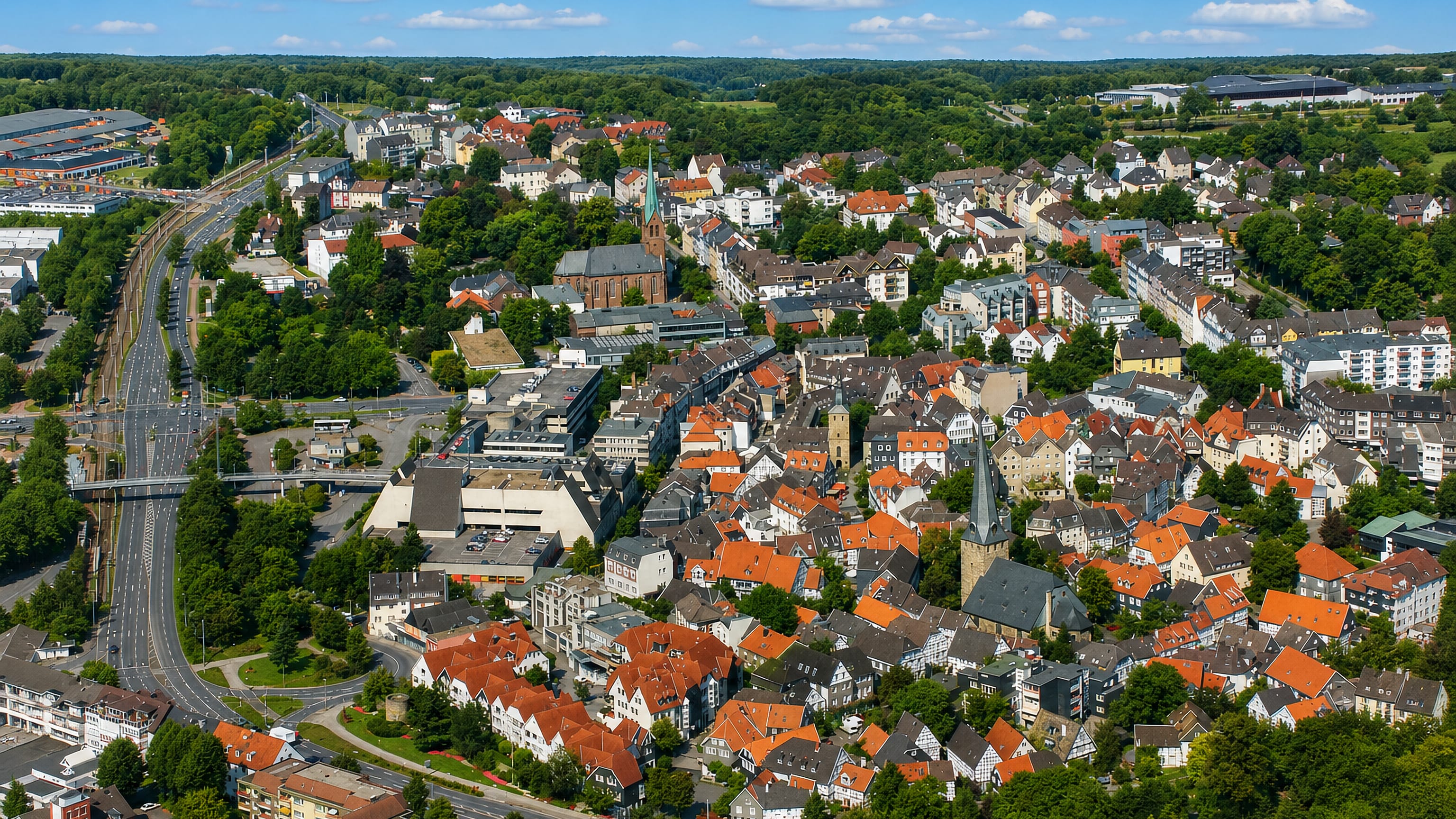 Aerial view of Hattingen, Germany, with its half-timbered old town, church spires and red-tiled roofs.