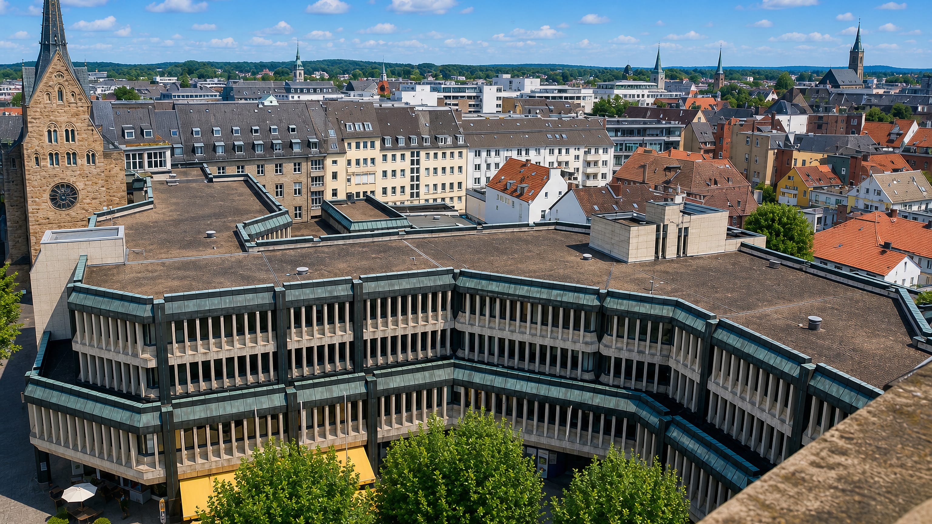 Aerial view over Minden, Germany, with old town church spires, tiled roofs and the central market building